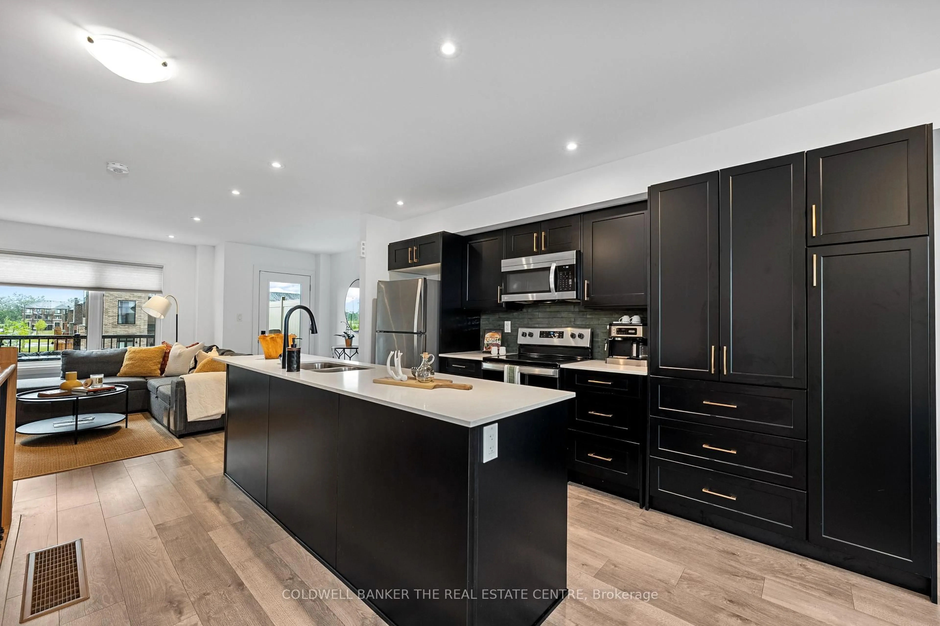 Open concept kitchen, wood/laminate floor for 121 Fairlane Ave, Barrie Ontario L9J 0M5