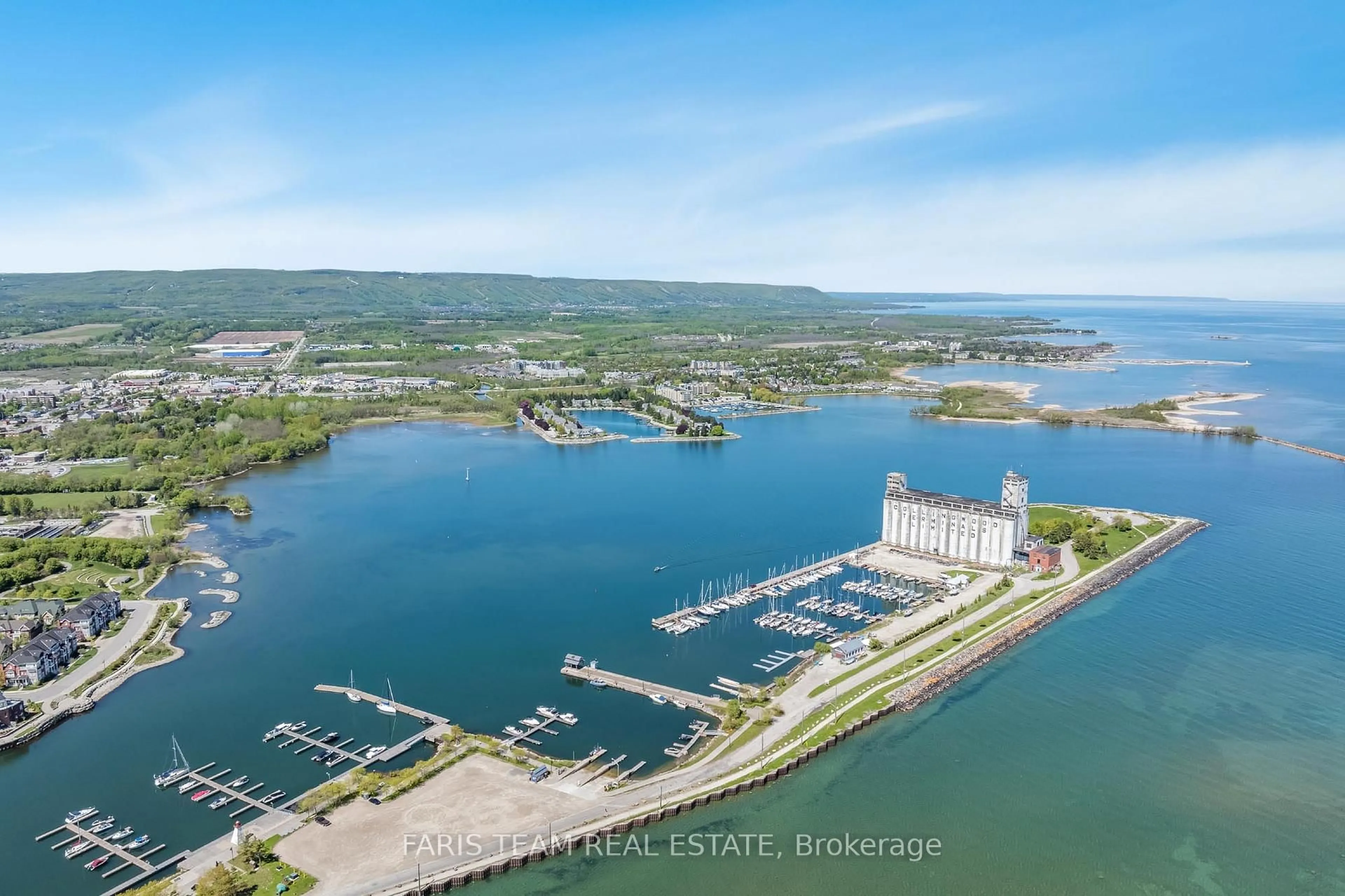 A pic from outside/outdoor area/front of a property/back of a property/a pic from drone, water/lake/river/ocean view for 31 Huron St #325, Collingwood Ontario L9Y 0E8