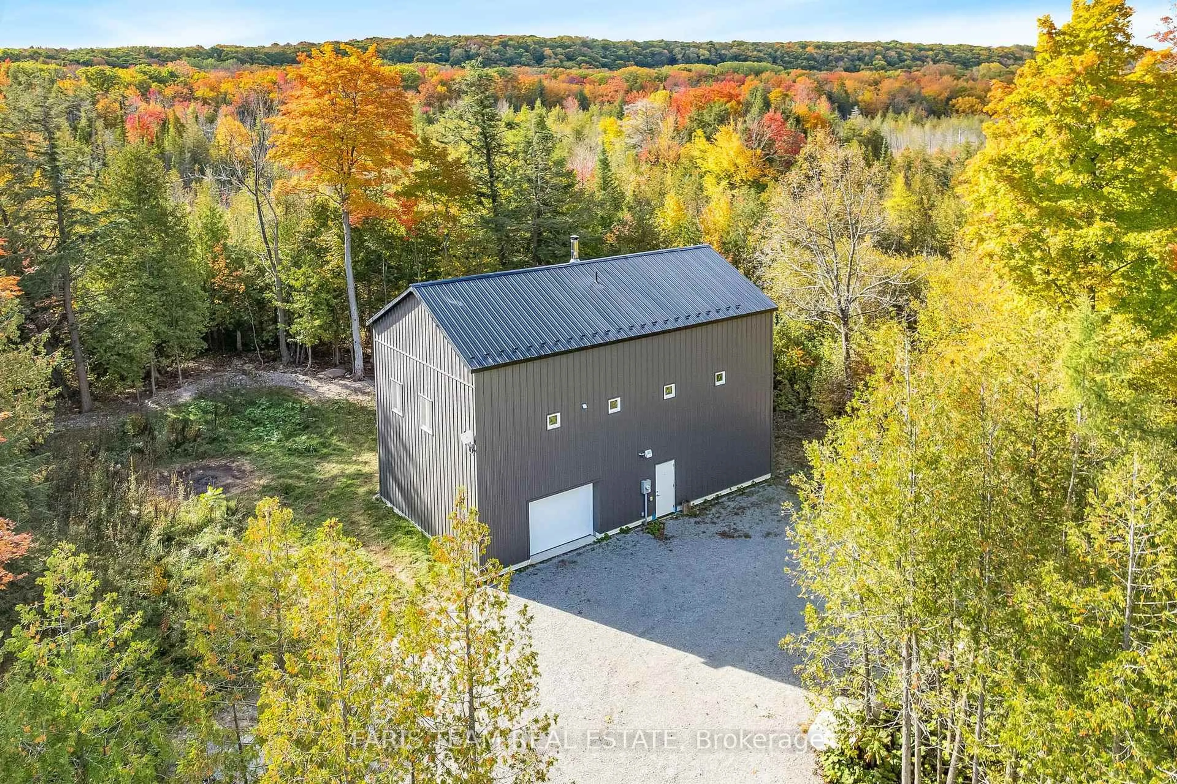 A pic from outside/outdoor area/front of a property/back of a property/a pic from drone, forest/trees view for 2576 Champlain Rd, Tiny Ontario L9M 0C9