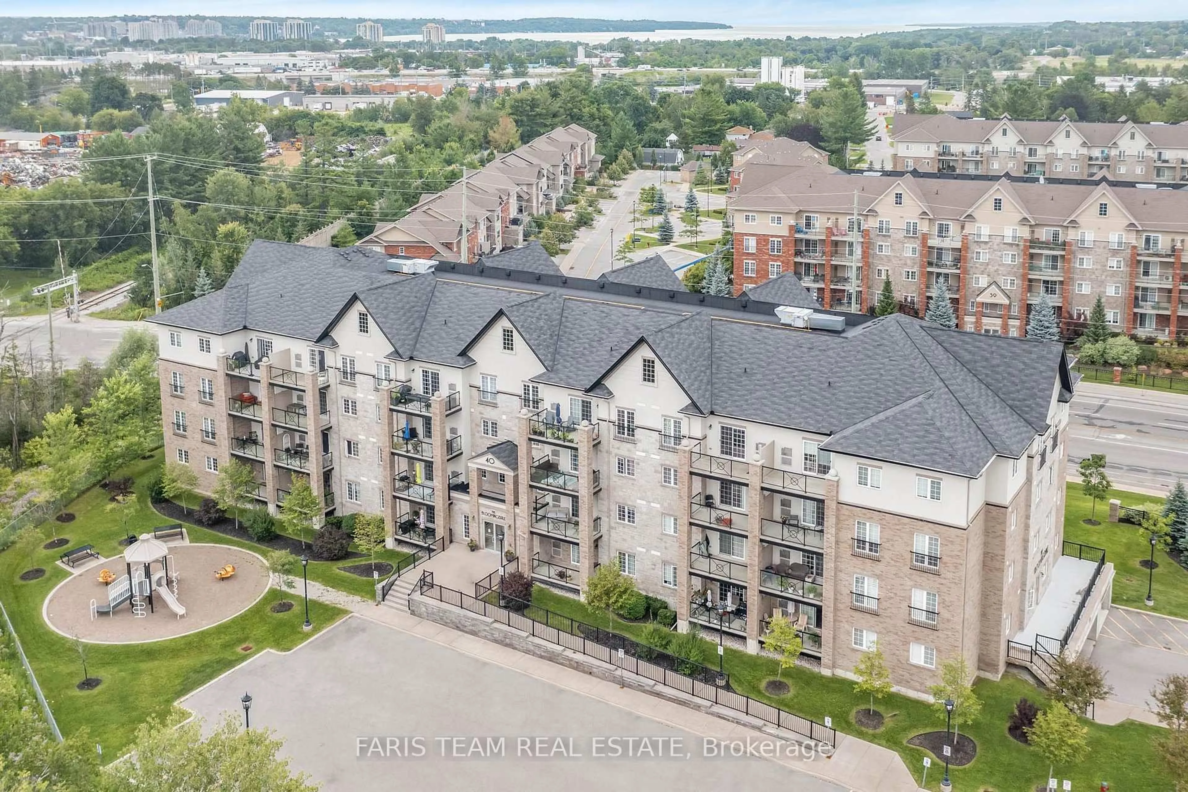 A pic from outside/outdoor area/front of a property/back of a property/a pic from drone, city buildings view from balcony for 40 Ferndale Dr #210, Barrie Ontario L4N 2L3