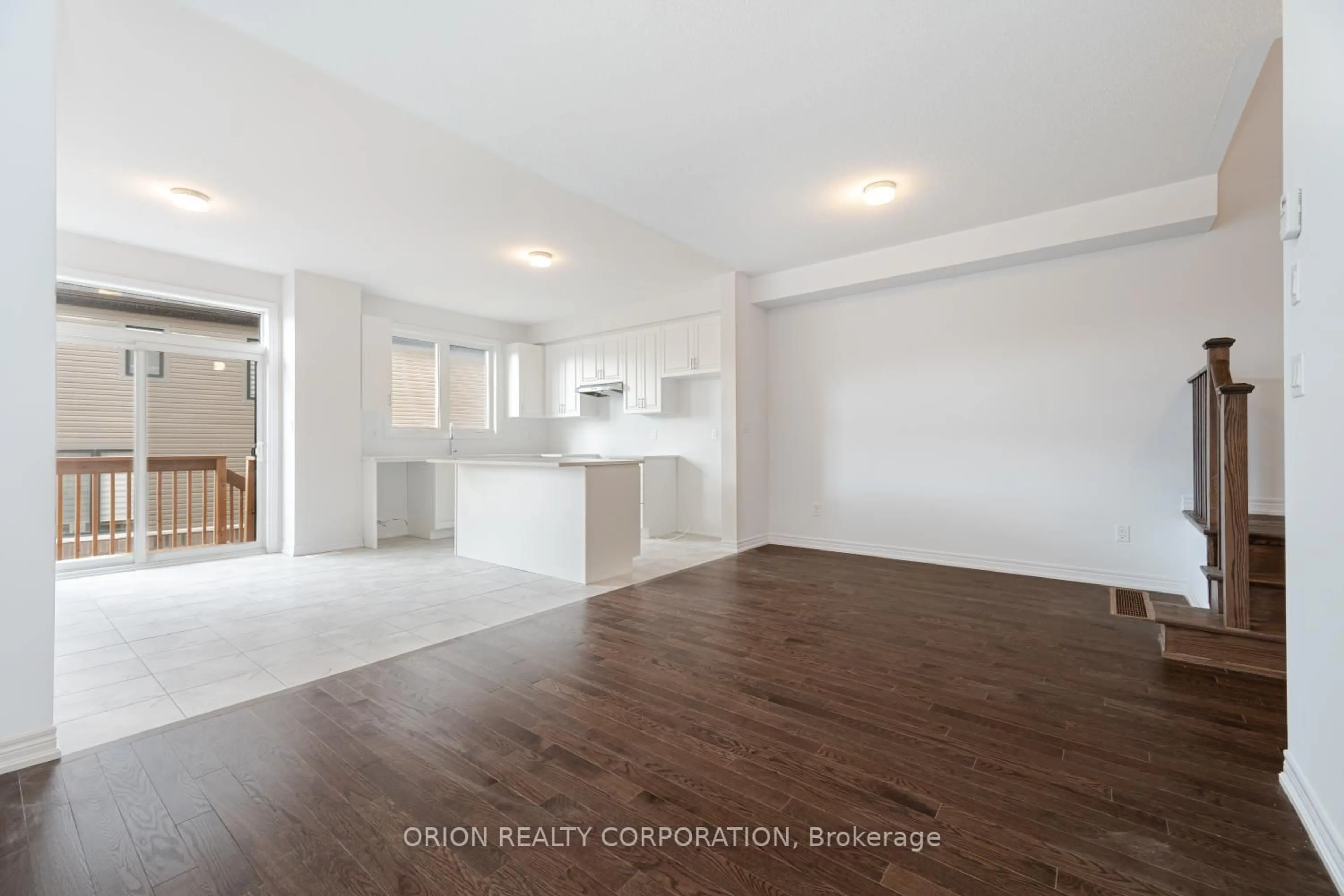 Open concept kitchen, wood/laminate floor for 133 Fenchurch Manr, Barrie Ontario L9J 0X1