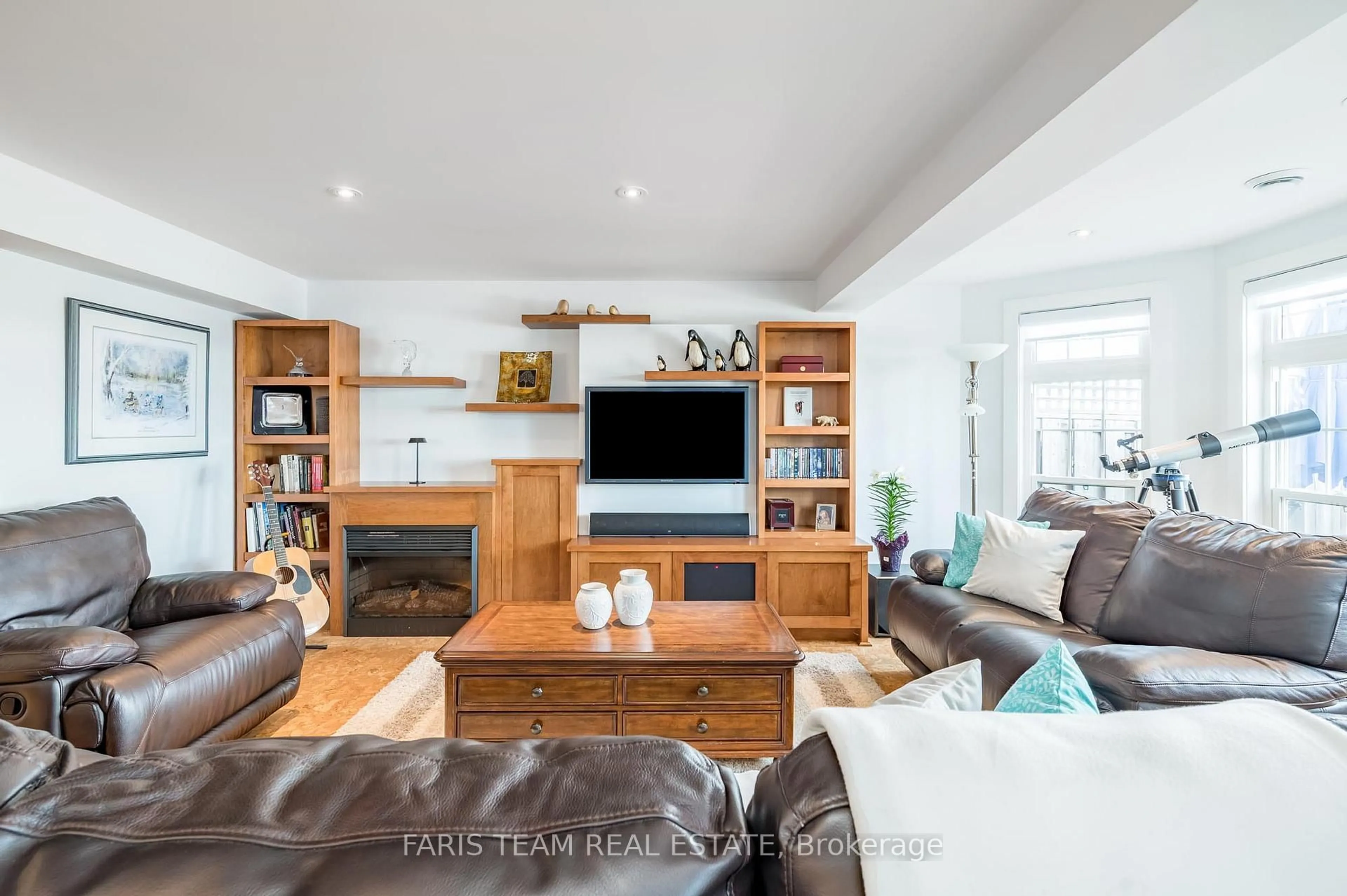 Living room with furniture, wood/laminate floor for 155 William St #12, Midland Ontario L4R 5N1