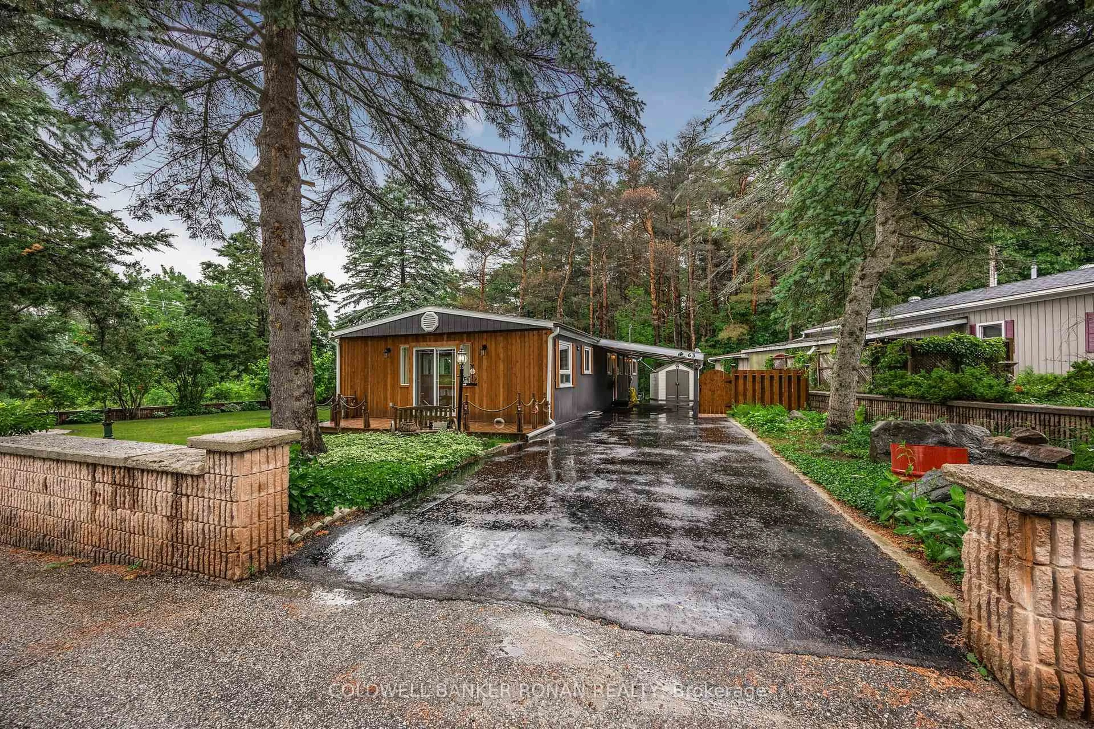 A pic from outside/outdoor area/front of a property/back of a property/a pic from drone, forest/trees view for 525 Midland Point Rd #63, Midland Ontario L4R 5G1