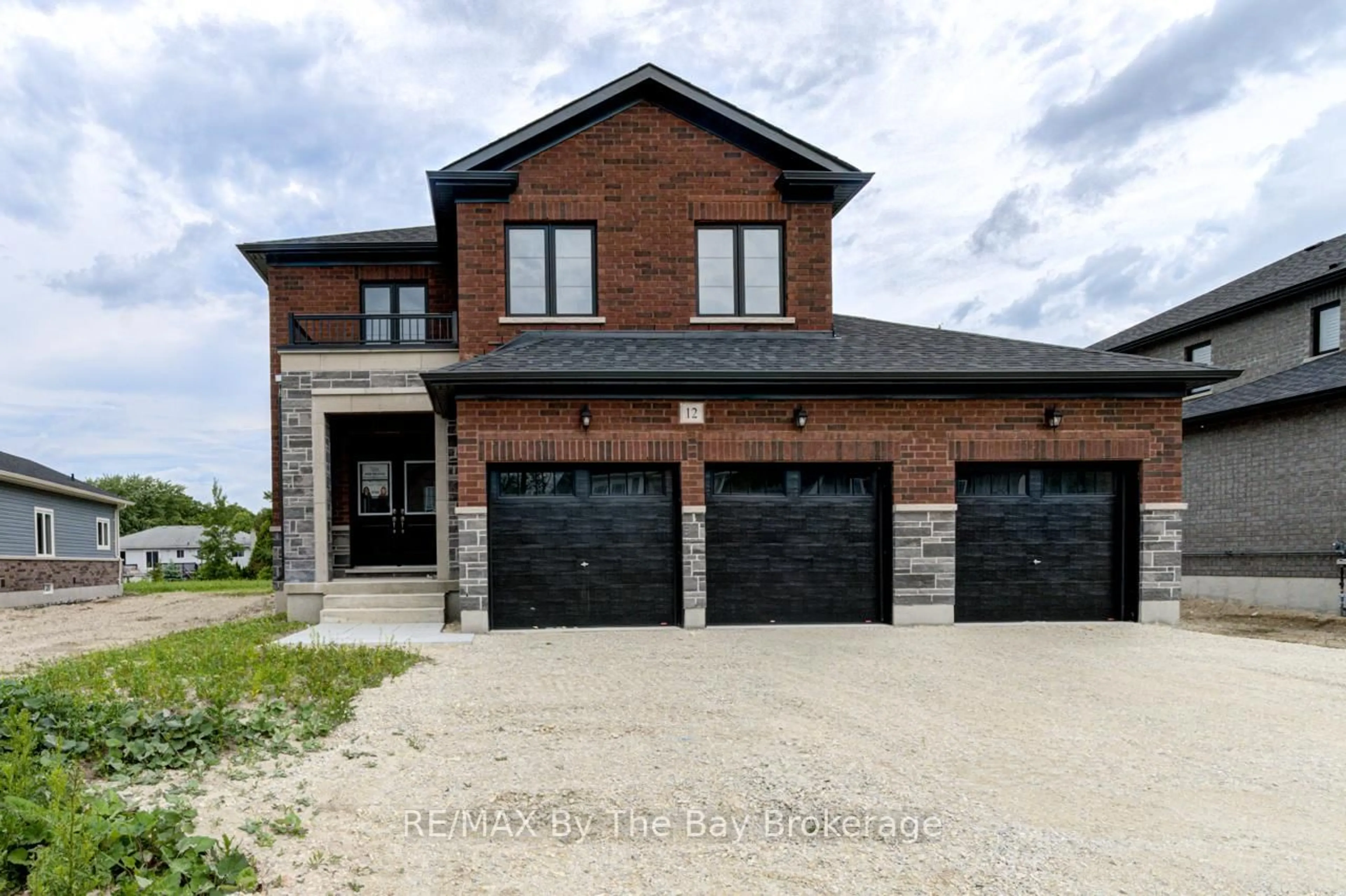 Home with brick exterior material, street for 12 Misty Ridge Rd, Wasaga Beach Ontario L9Z 0R8