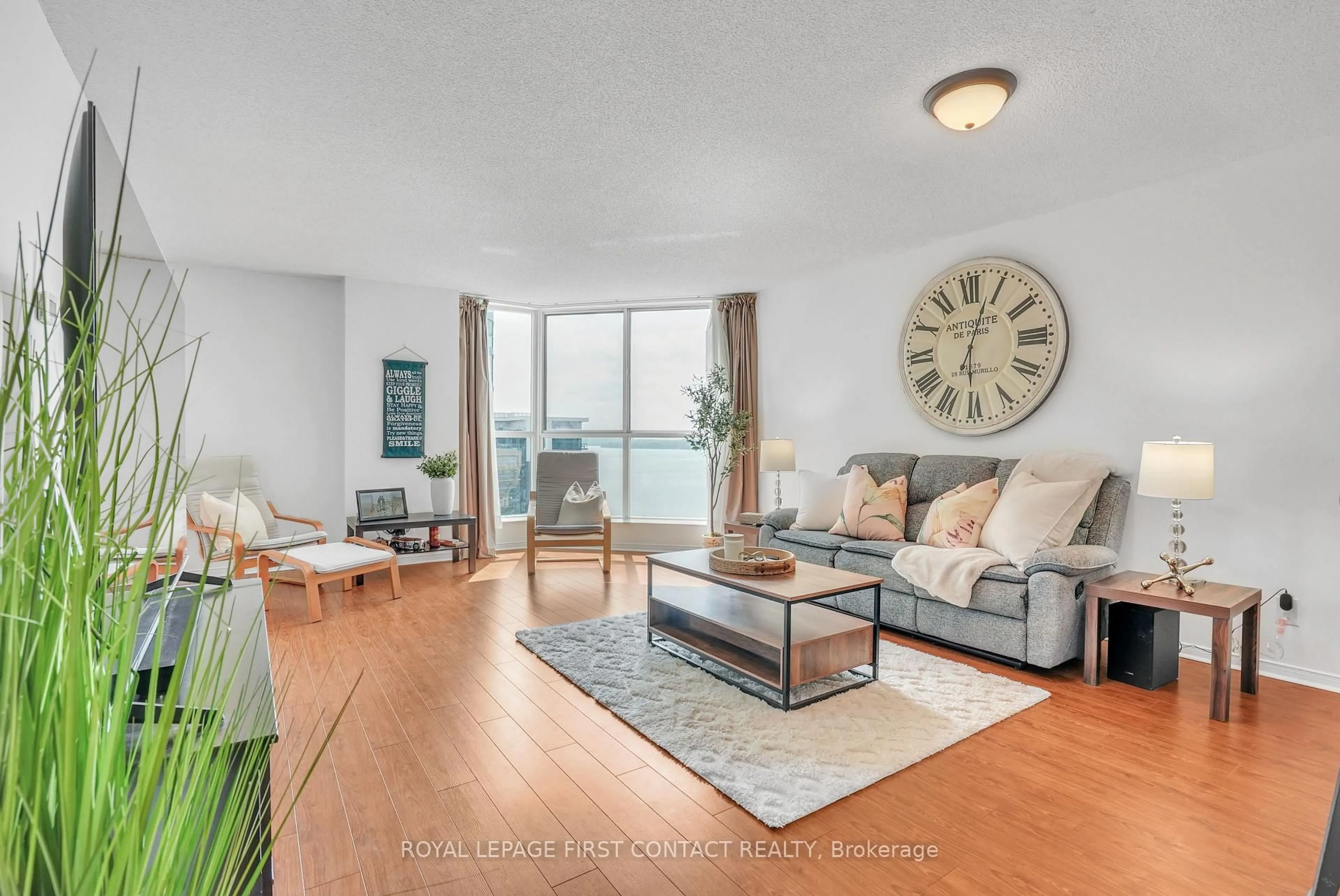 Living room with furniture, wood/laminate floor for 140 Dunlop St #908, Barrie Ontario L4M 6H9