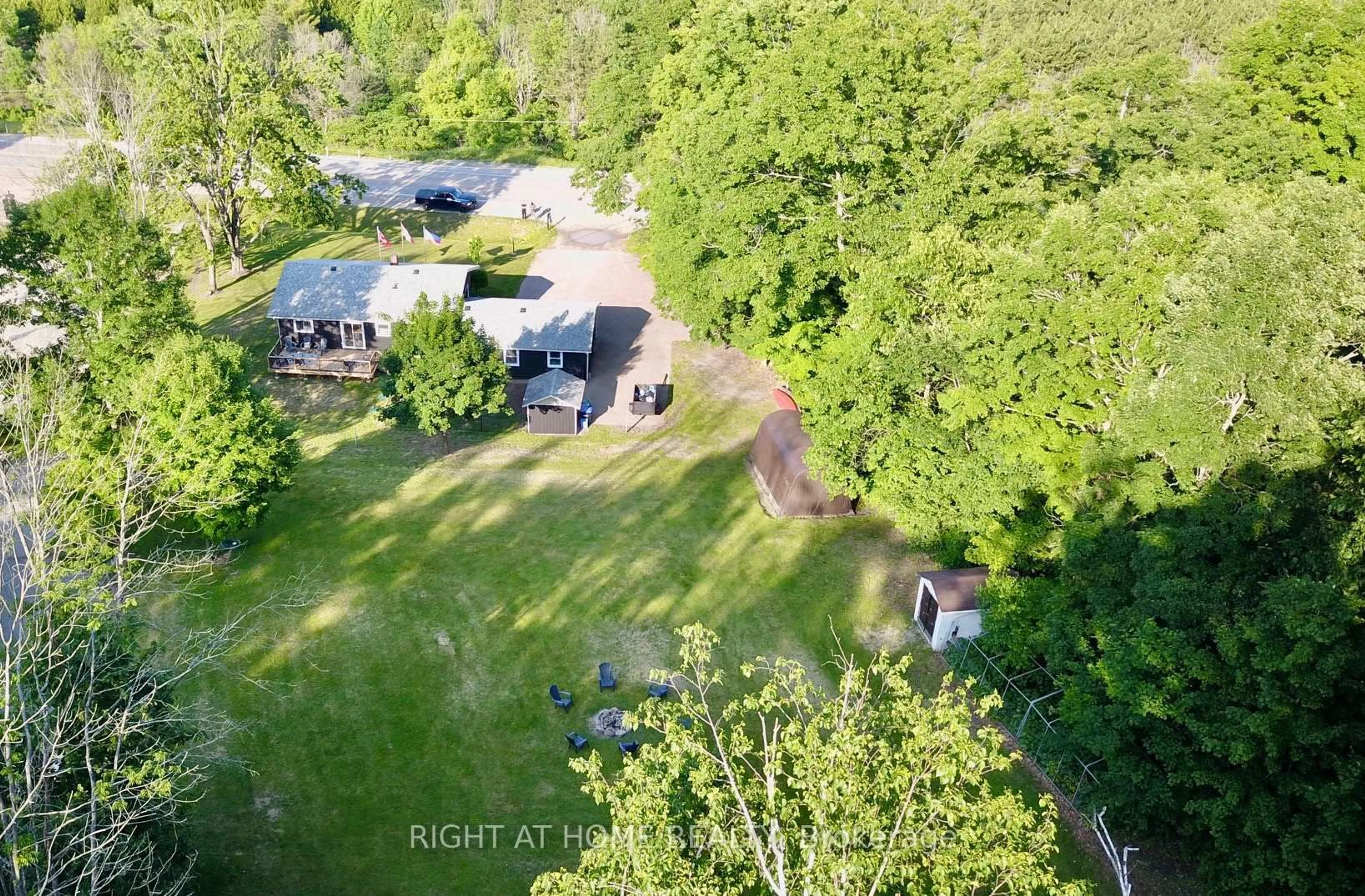 A pic from outside/outdoor area/front of a property/back of a property/a pic from drone, forest/trees view for 6680 County Rd 93 Highway, Tay Ontario L0K 2E0