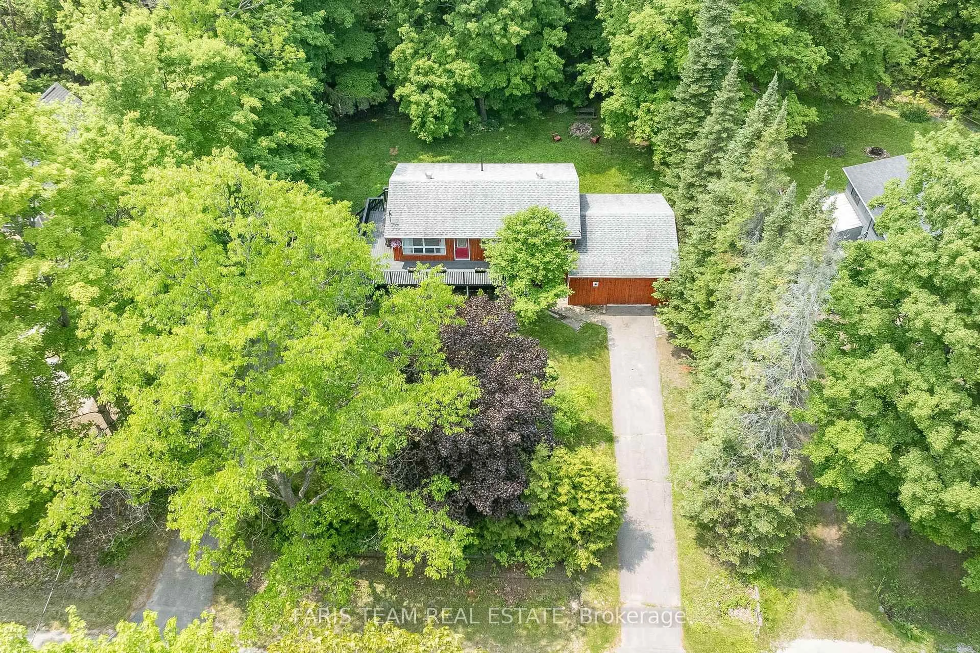 A pic from outside/outdoor area/front of a property/back of a property/a pic from drone, forest/trees view for 1474 Champlain Rd, Tiny Ontario L9M 0C1