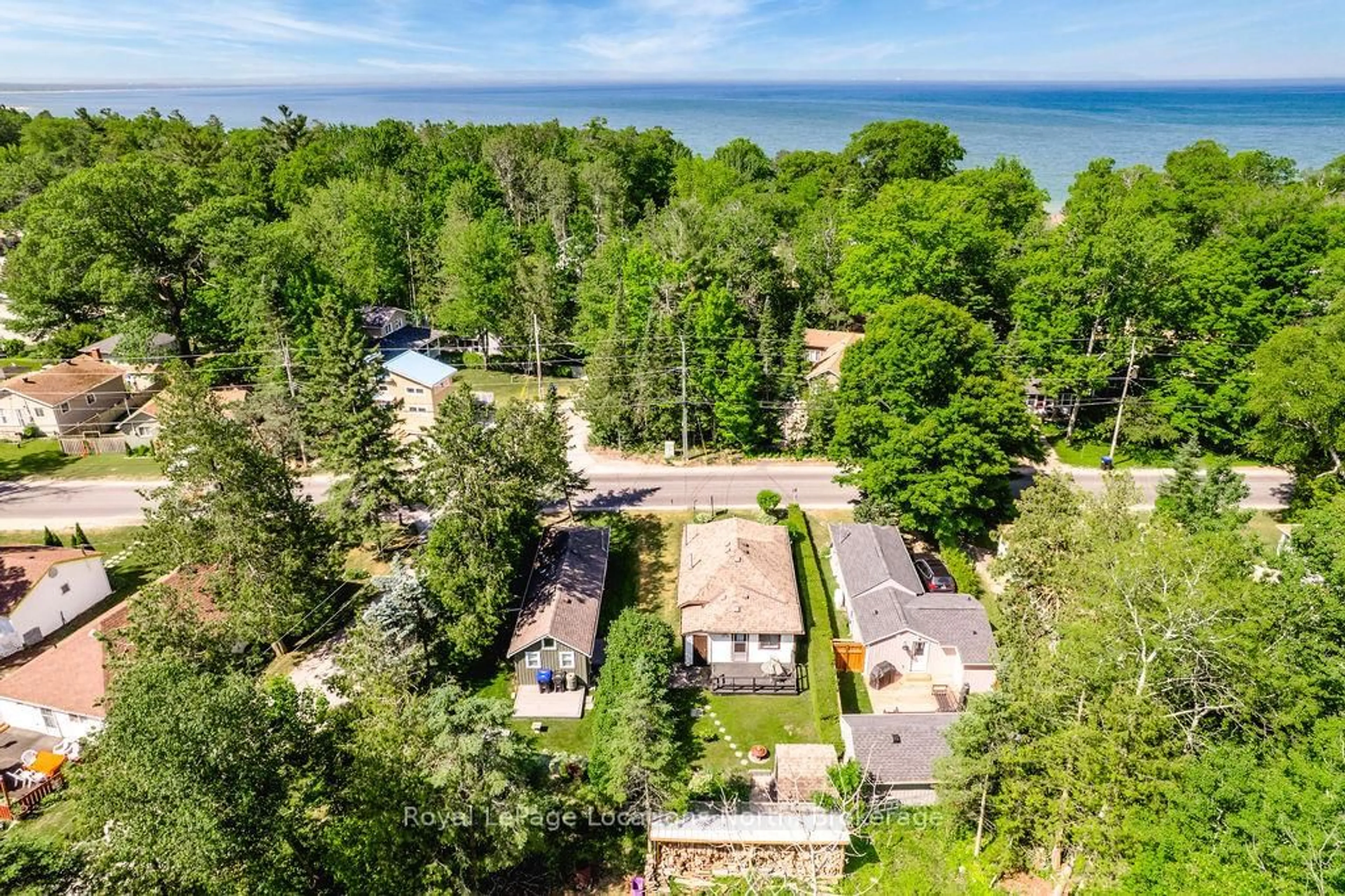A pic from outside/outdoor area/front of a property/back of a property/a pic from drone, water/lake/river/ocean view for 1981 TINY BEACHES Rd, Tiny Ontario L9M 1R3