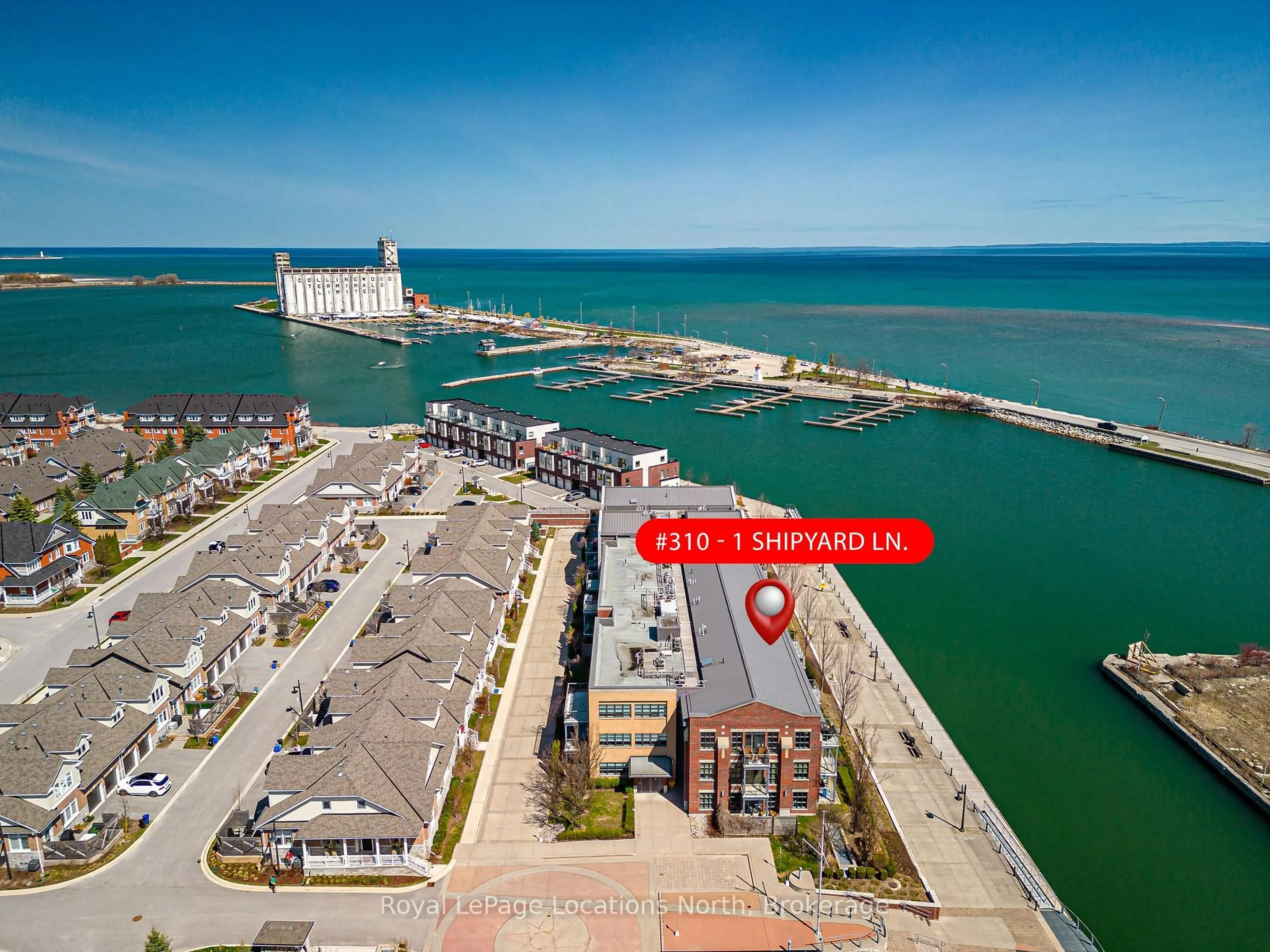 A pic from outside/outdoor area/front of a property/back of a property/a pic from drone, water/lake/river/ocean view for 1 Shipyard Lane #310, Collingwood Ontario L9Y 0W2