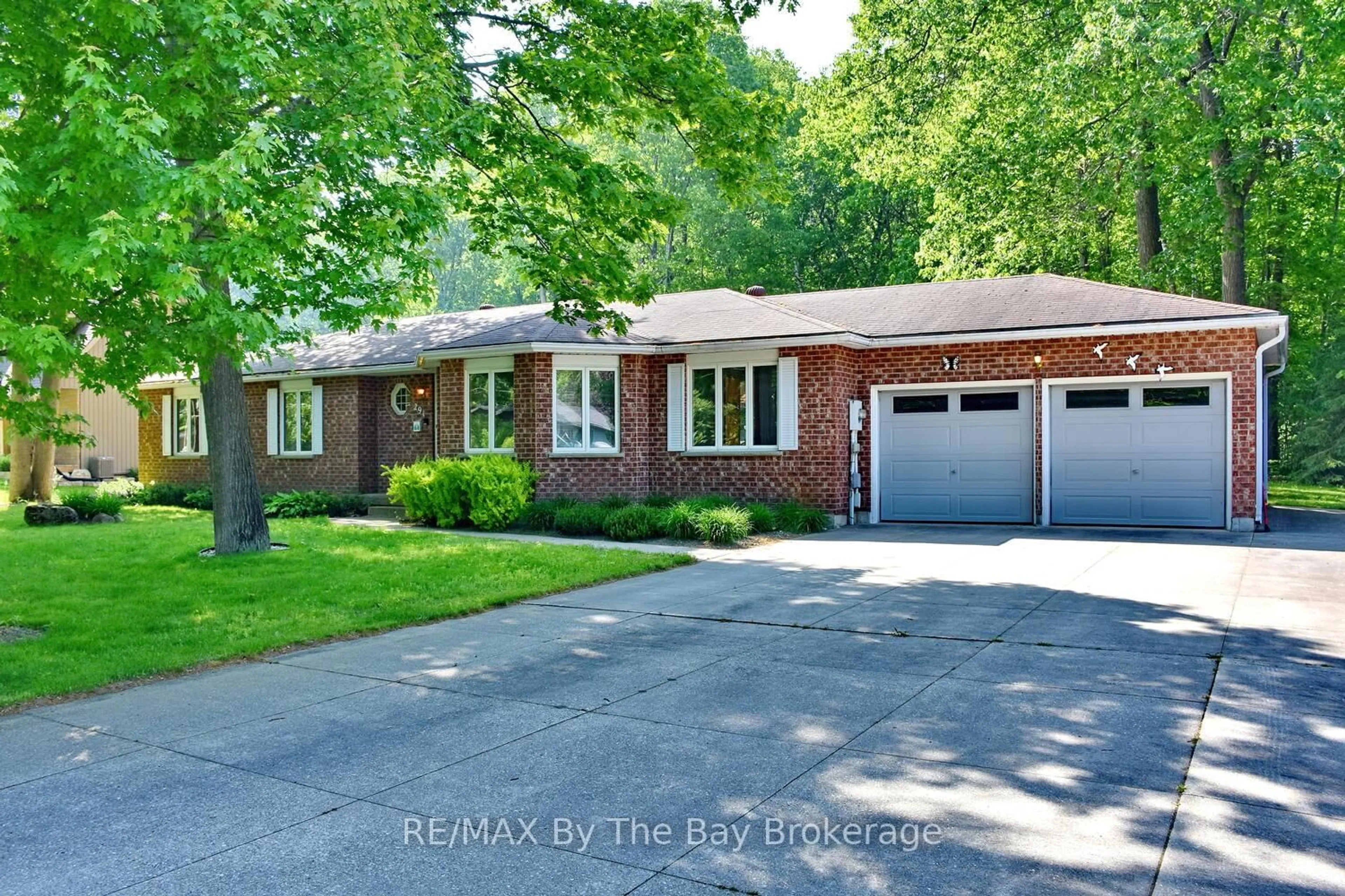 Home with brick exterior material, street for 291 Wildwood Dr, Wasaga Beach Ontario L9Z 1R6