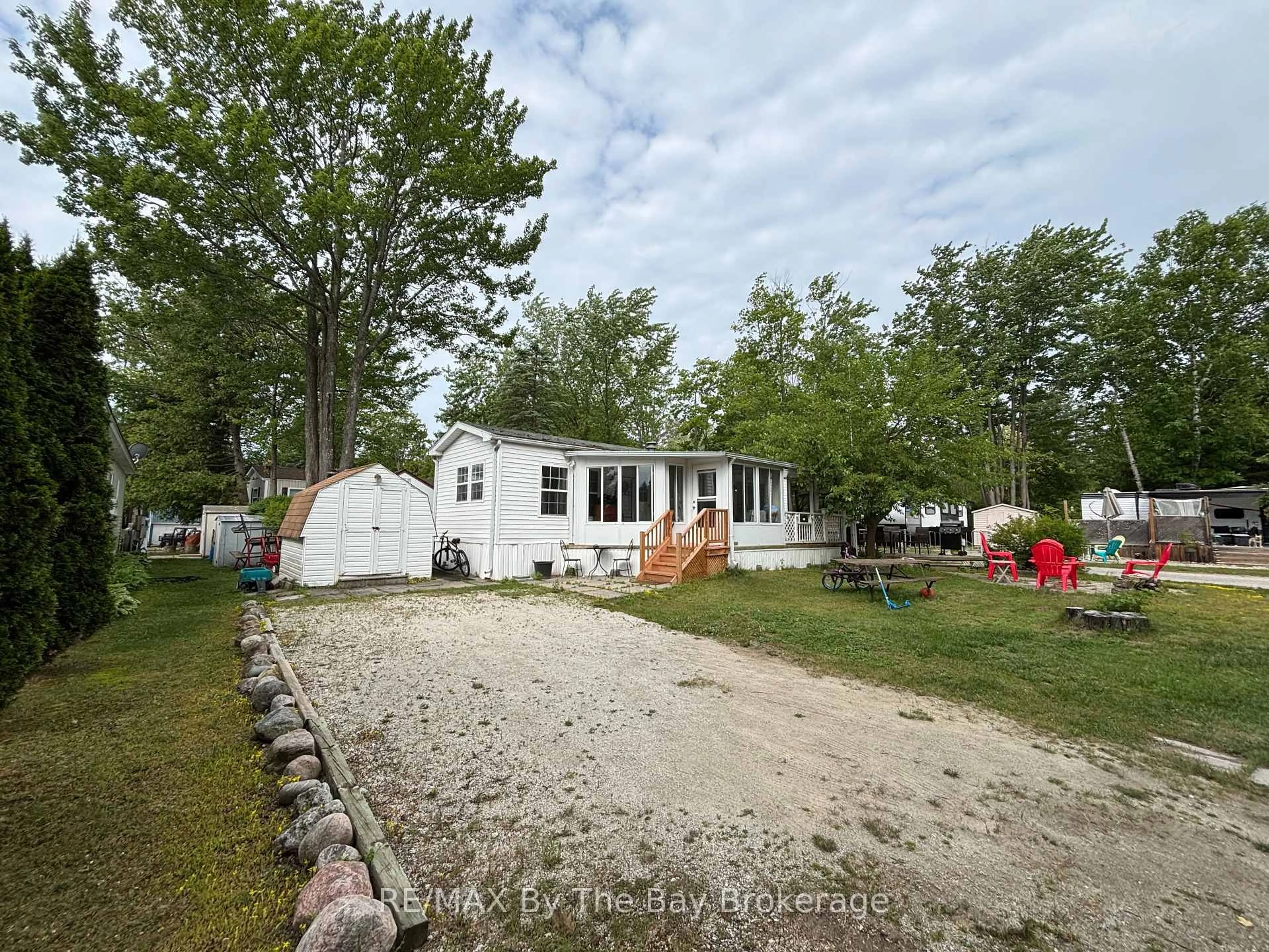 A pic from outside/outdoor area/front of a property/back of a property/a pic from drone, water/lake/river/ocean view for 85 THEME PARK Dr #173, Wasaga Beach Ontario L9Z 1X7