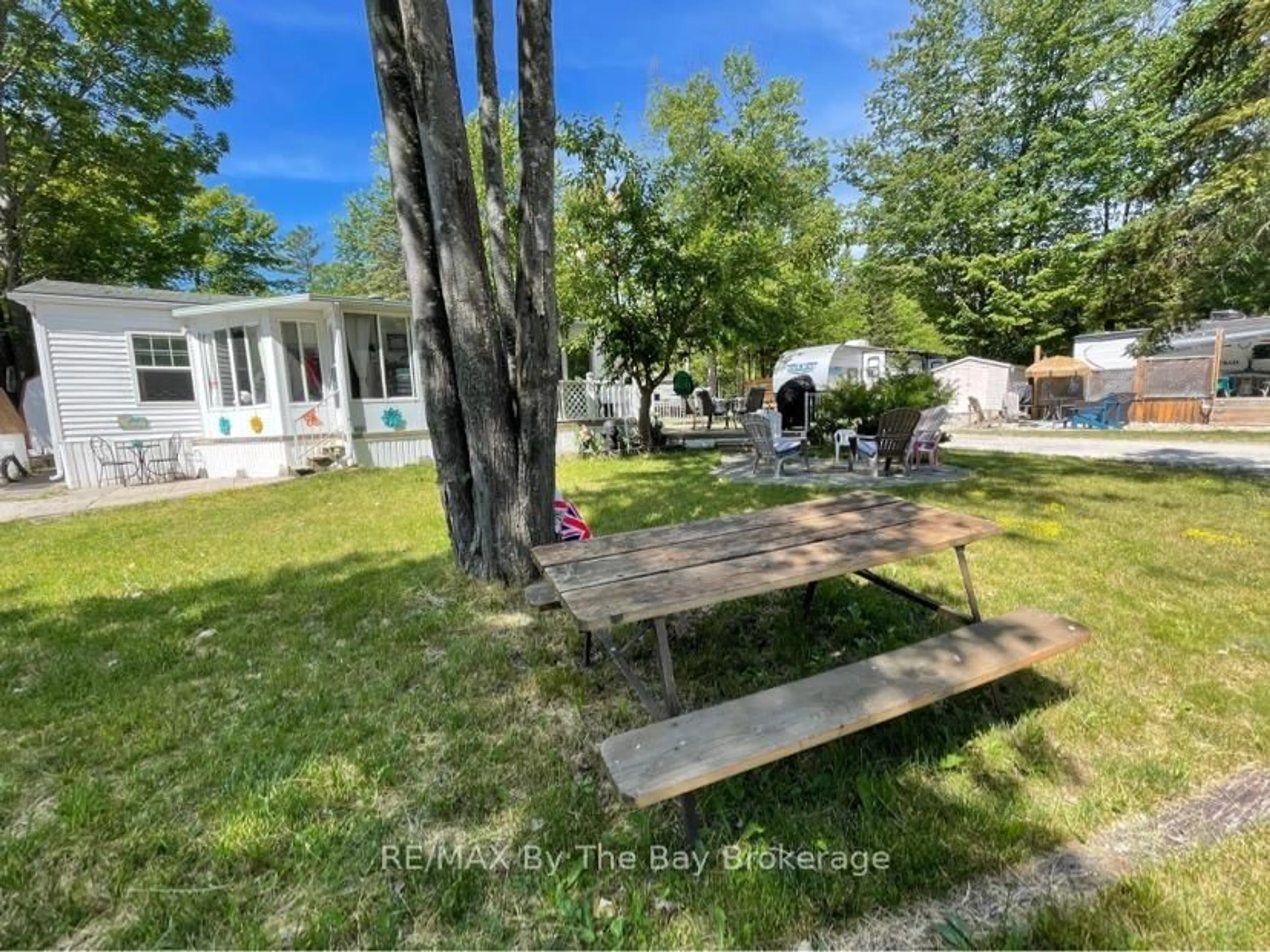 A pic from outside/outdoor area/front of a property/back of a property/a pic from drone, water/lake/river/ocean view for 85 THEME PARK Dr #173, Wasaga Beach Ontario L9Z 1X7