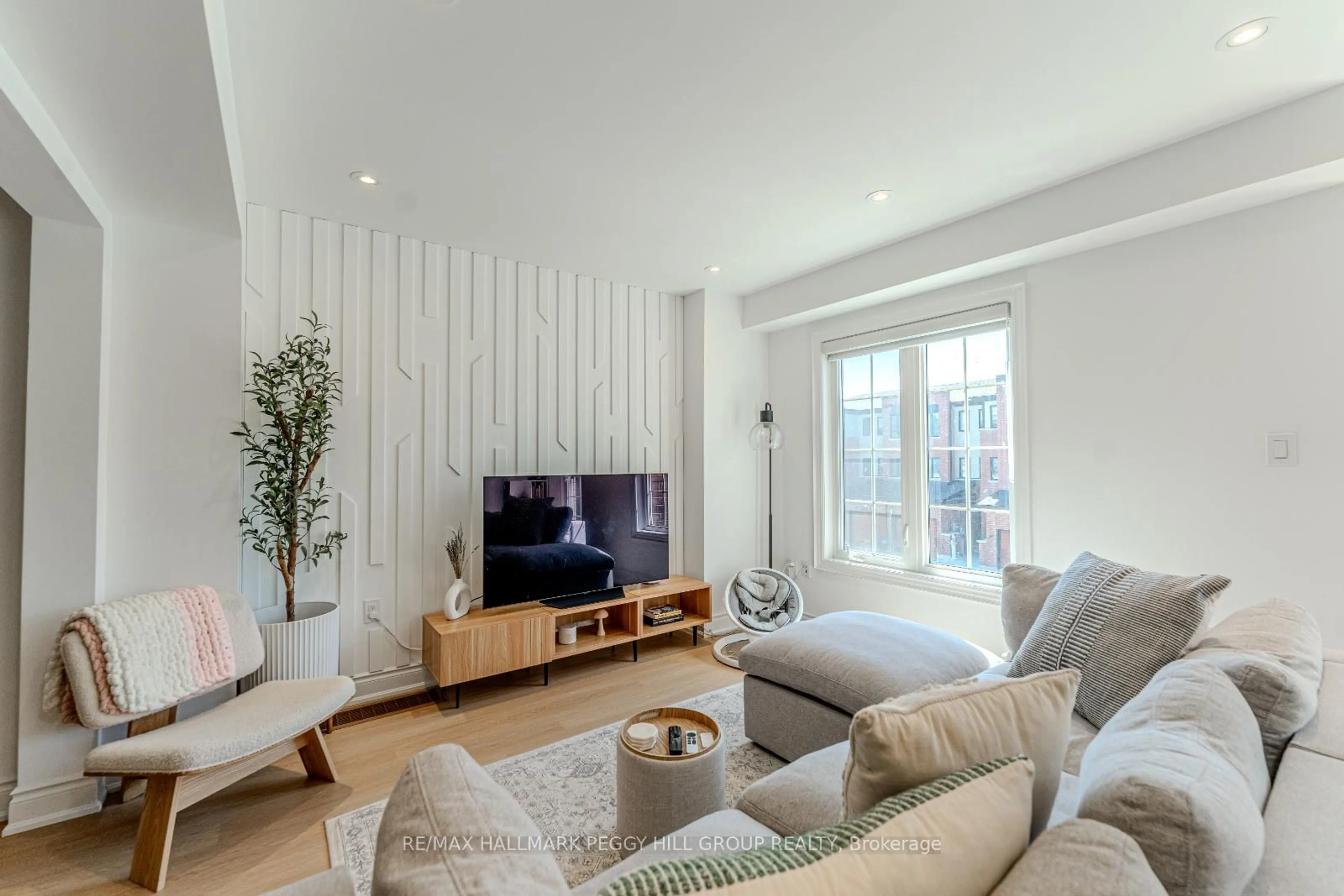 Living room with furniture, wood/laminate floor for 48 Hay Lane, Barrie Ontario L9J 0T8