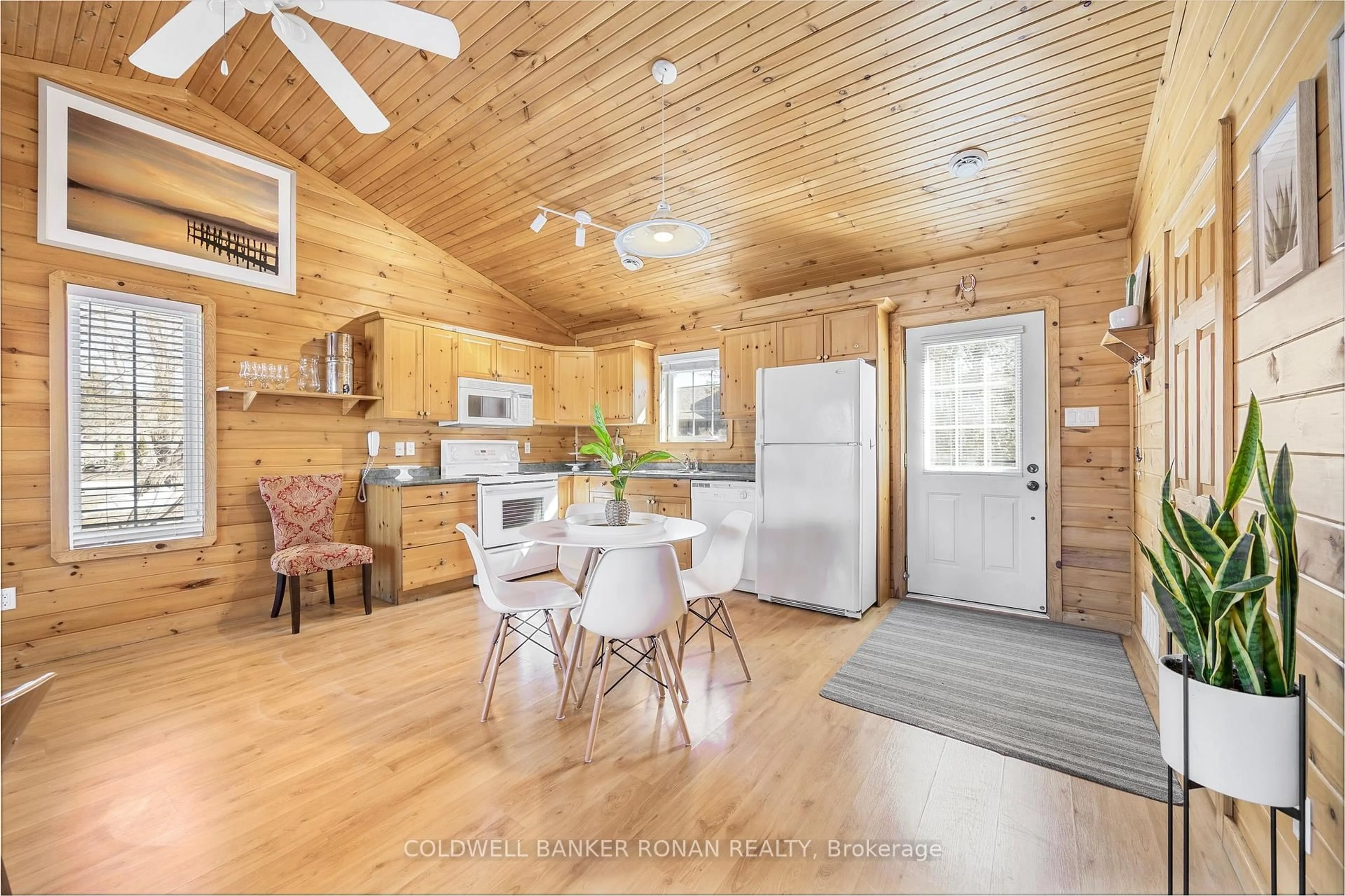 Open concept kitchen, wood/laminate floor for 26 Cabin Cres, Wasaga Beach Ontario L9Z 1X7