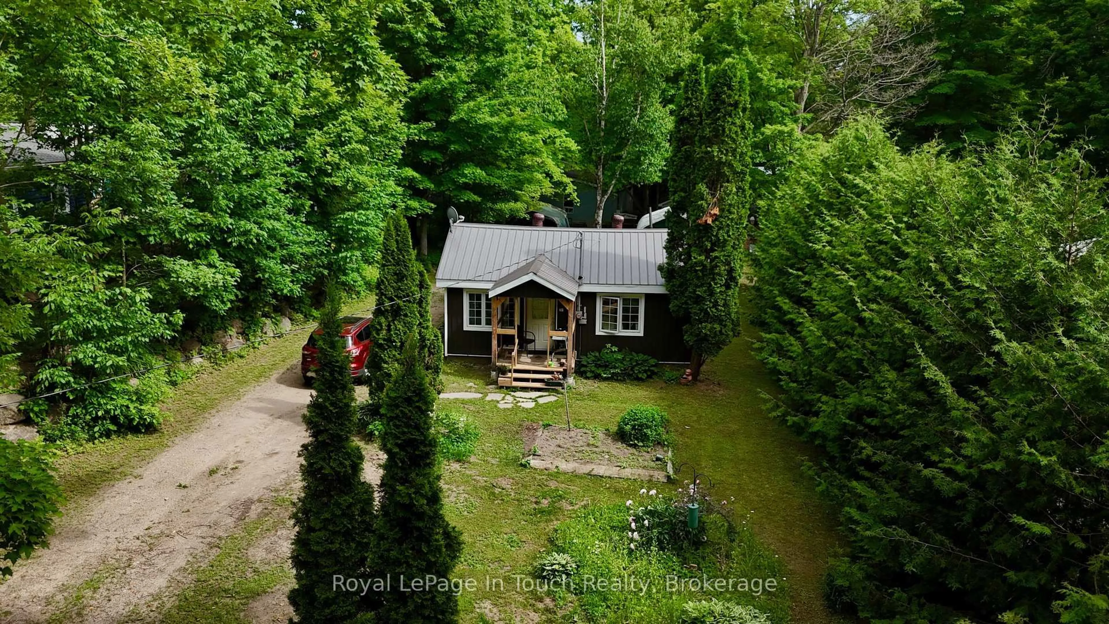 A pic from outside/outdoor area/front of a property/back of a property/a pic from drone, forest/trees view for 19 Needle Rd, Tiny Ontario L9M 0B5