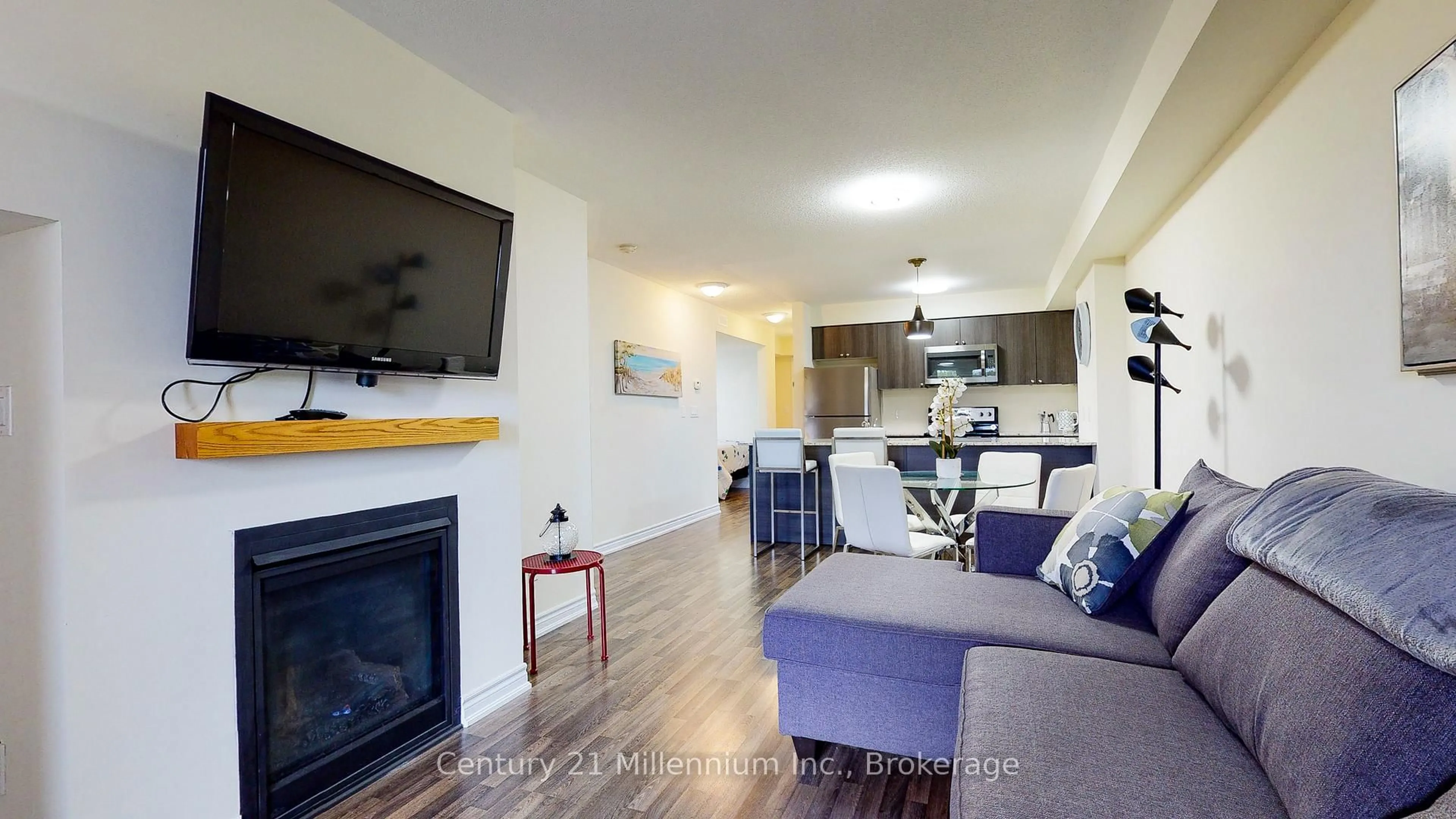 Living room with furniture, wood/laminate floor for 6 Anchorage Cres #205, Collingwood Ontario L9Y 0Y6