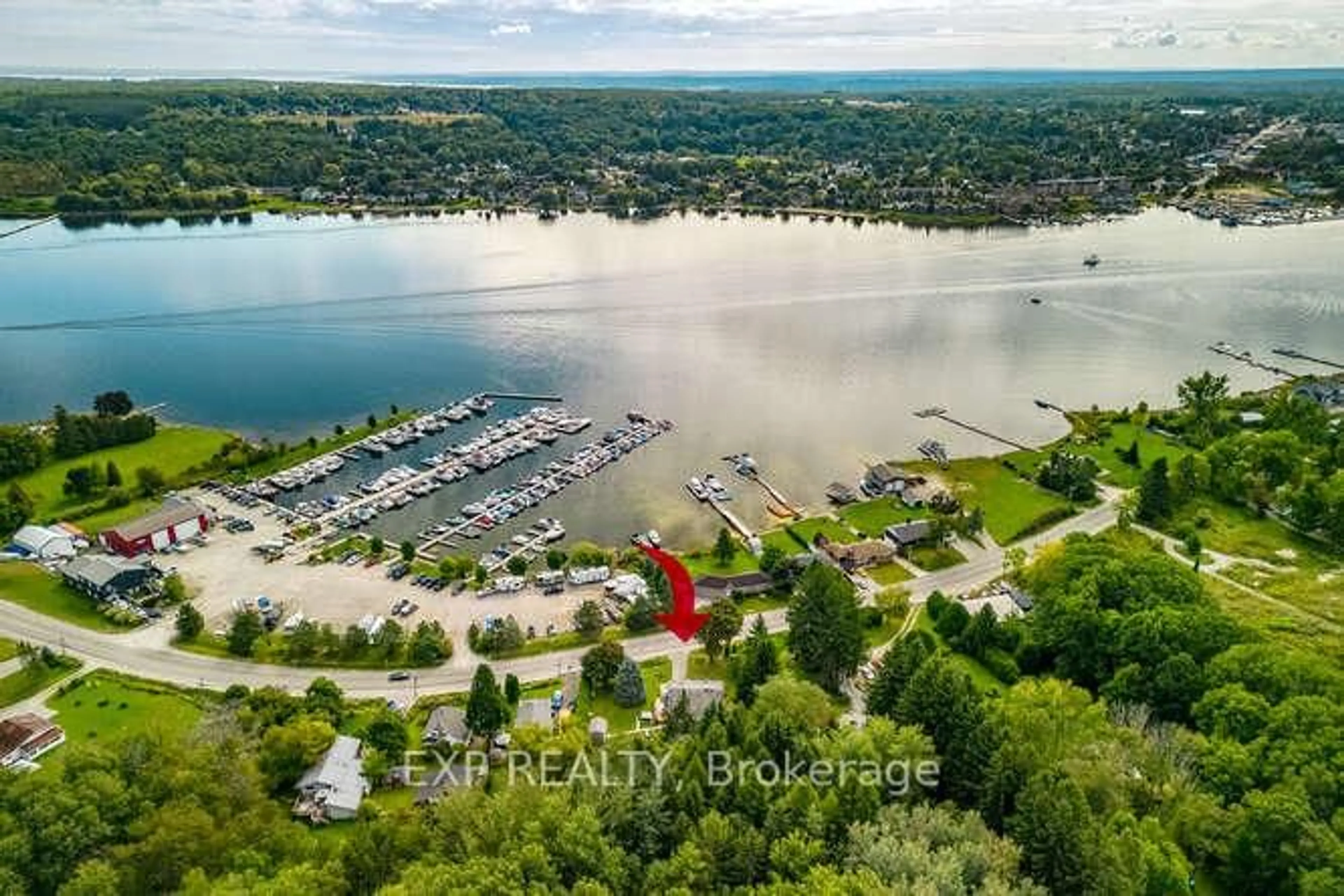 A pic from outside/outdoor area/front of a property/back of a property/a pic from drone, water/lake/river/ocean view for 304 Champlain Rd, Penetanguishene Ontario L9M 1S4