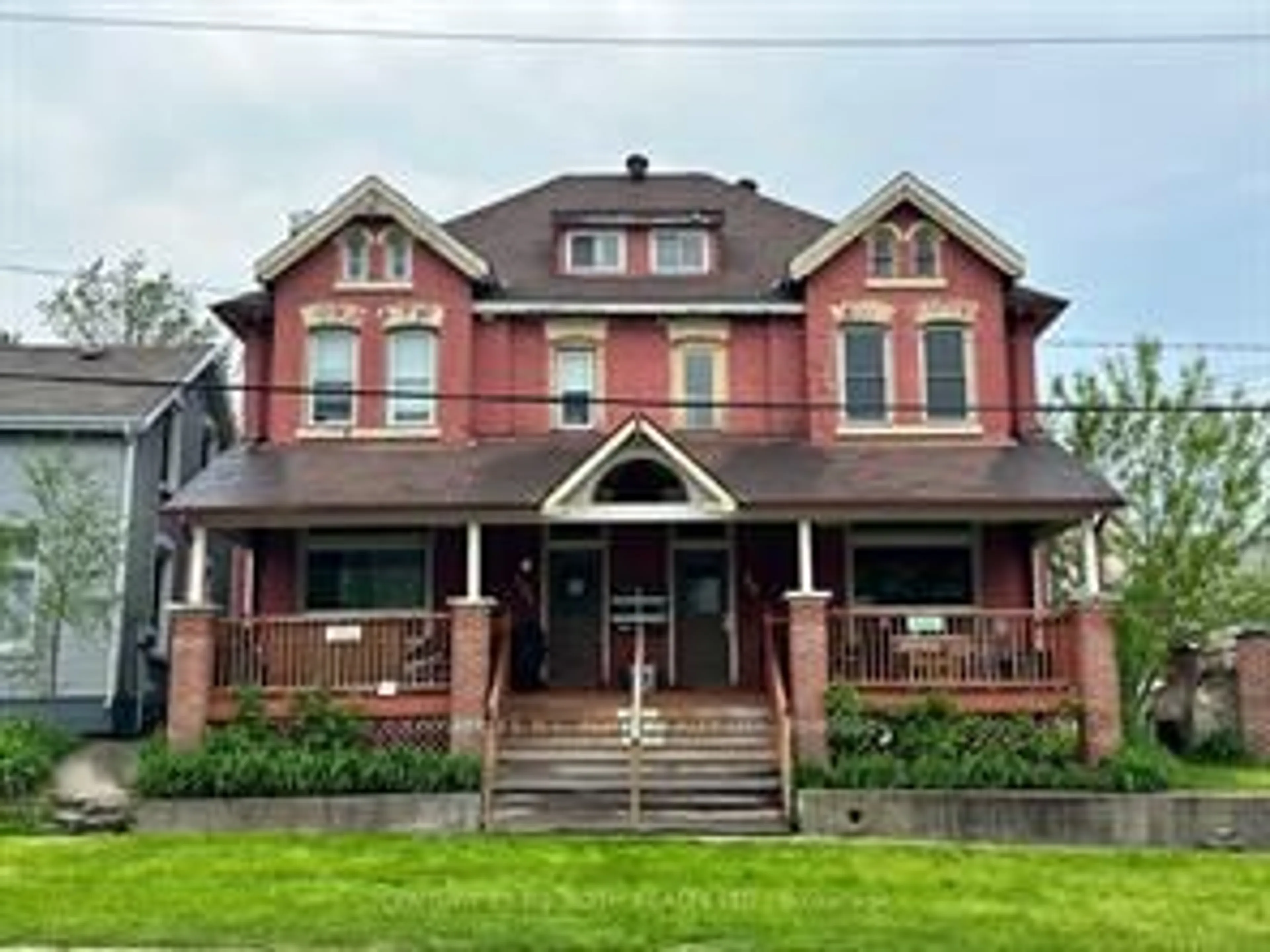 Home with brick exterior material, street for 99 Mulcaster St, Barrie Ontario L4M 3M7