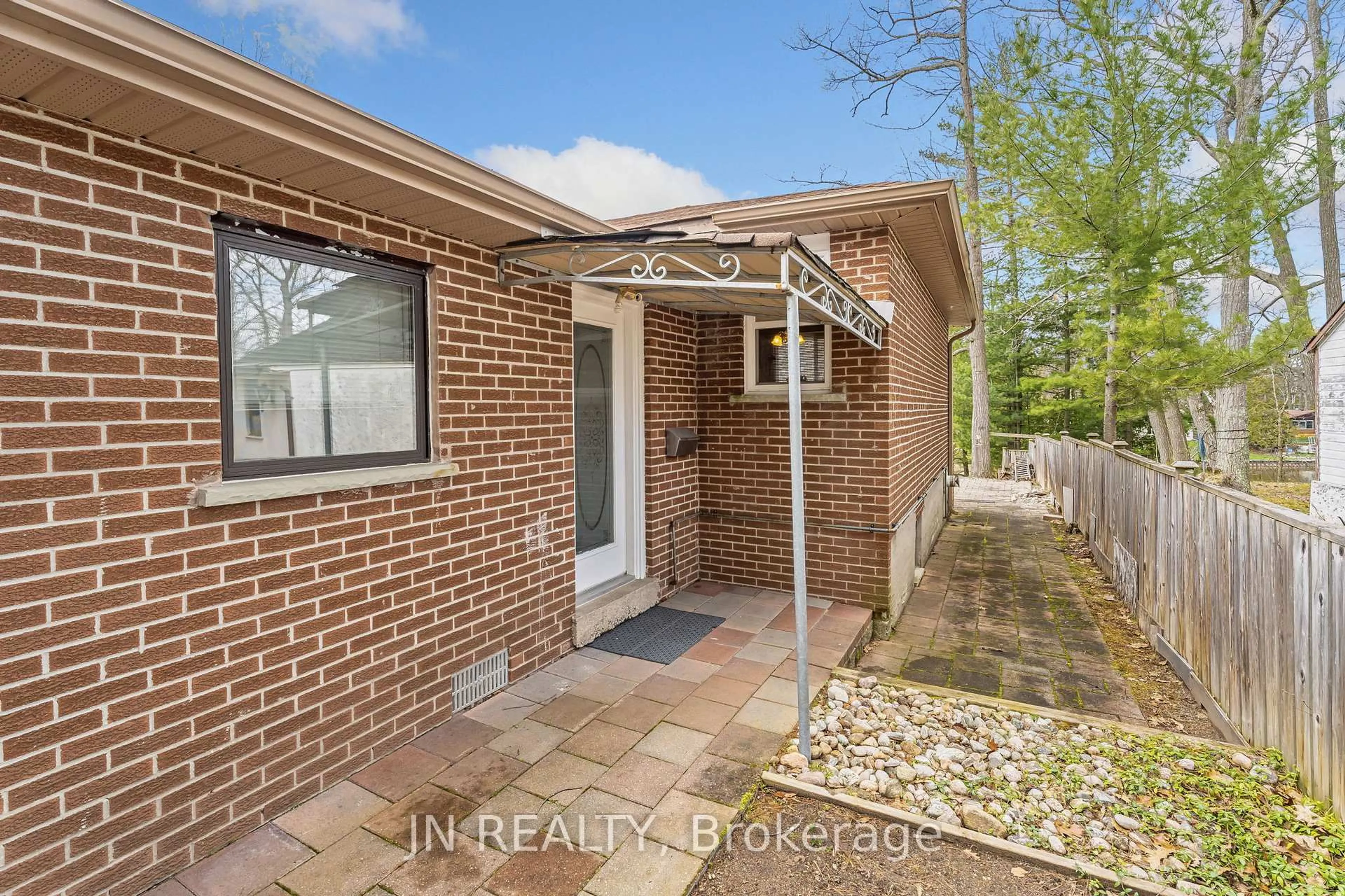 Home with brick exterior material, street for 322 Oxbow Park Dr, Wasaga Beach Ontario L9Z 2V6
