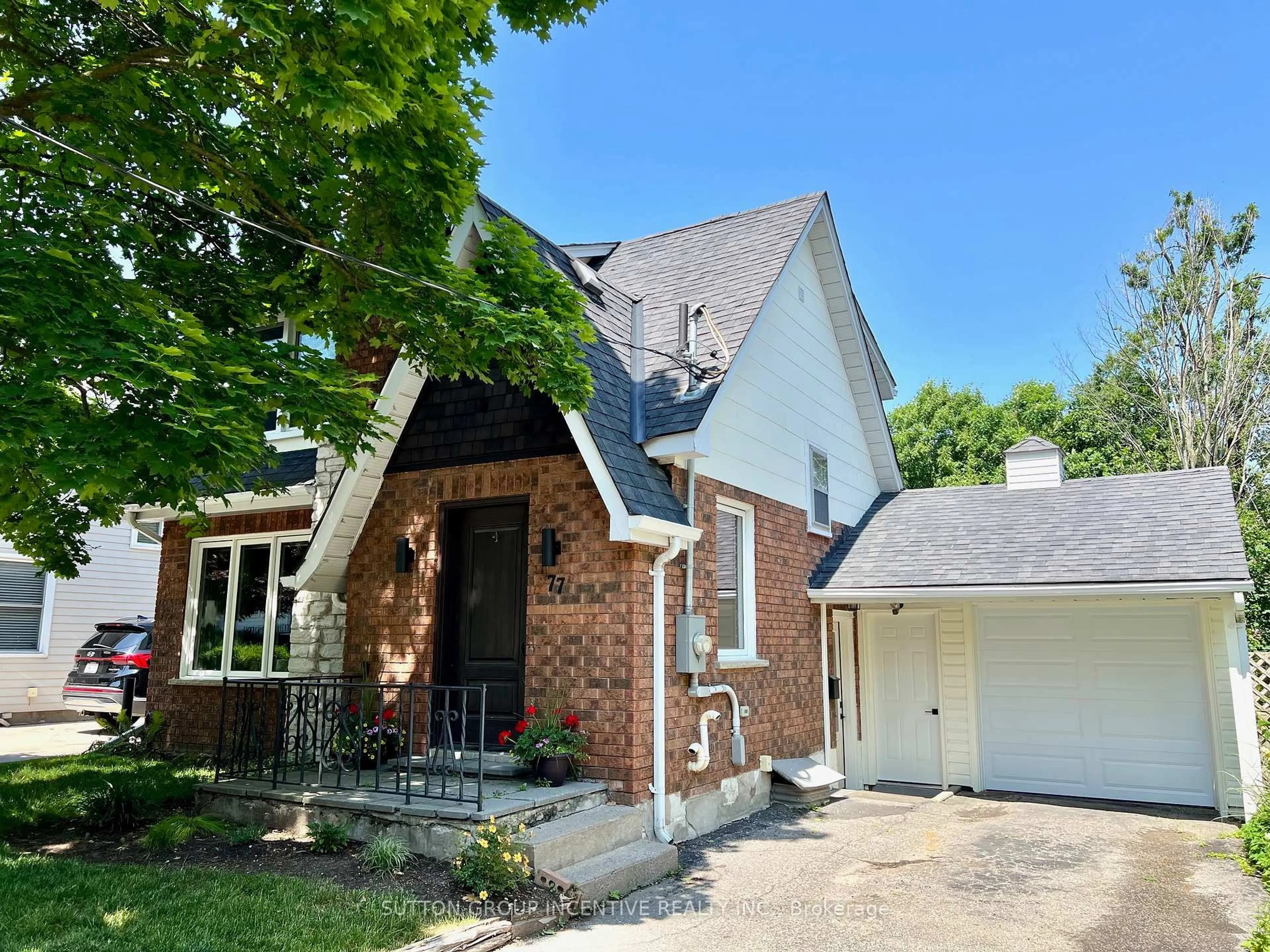 Home with brick exterior material, street for 77 Drury Lane, Barrie Ontario L4M 3C9