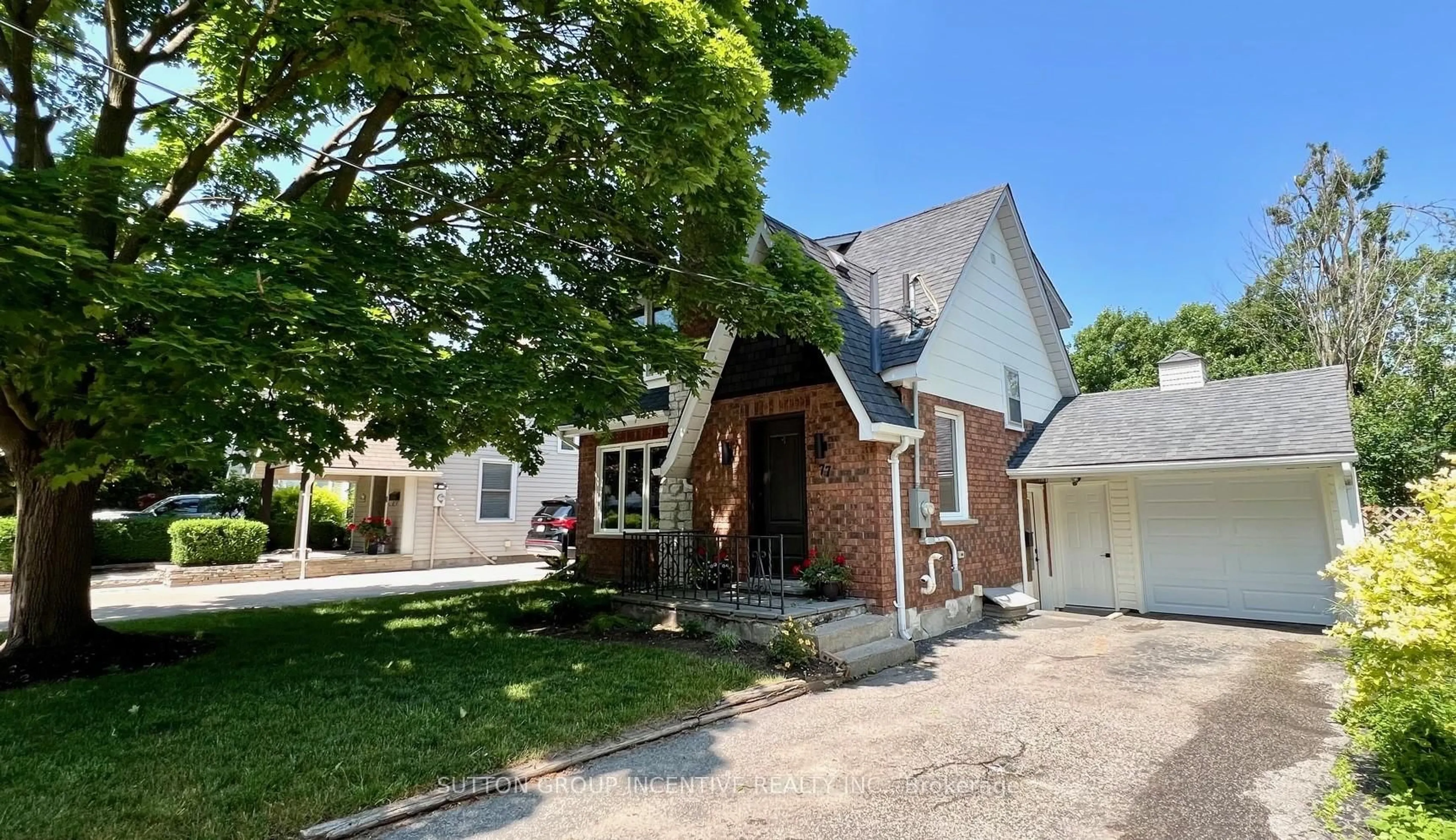 Home with brick exterior material, street for 77 Drury Lane, Barrie Ontario L4M 3C9