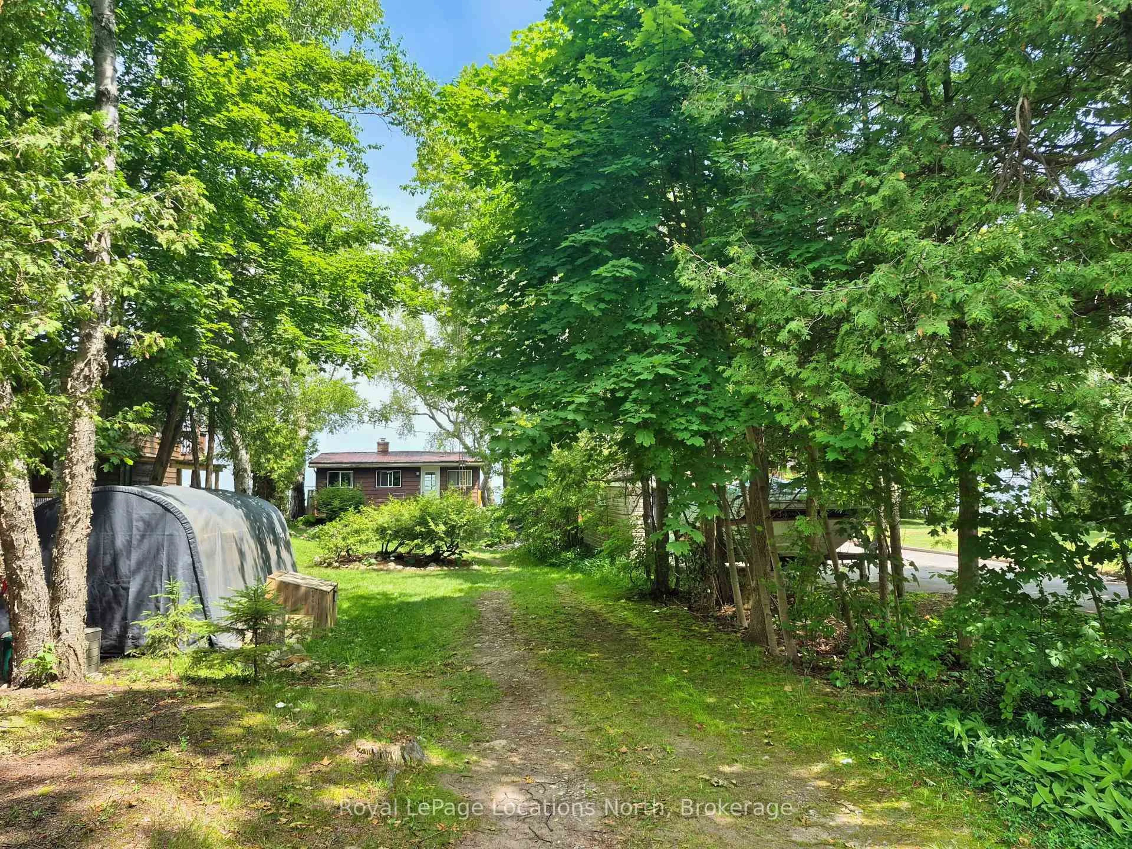 A pic from outside/outdoor area/front of a property/back of a property/a pic from drone, forest/trees view for 1950 Shore Lane, Wasaga Beach Ontario L9Z 1T7