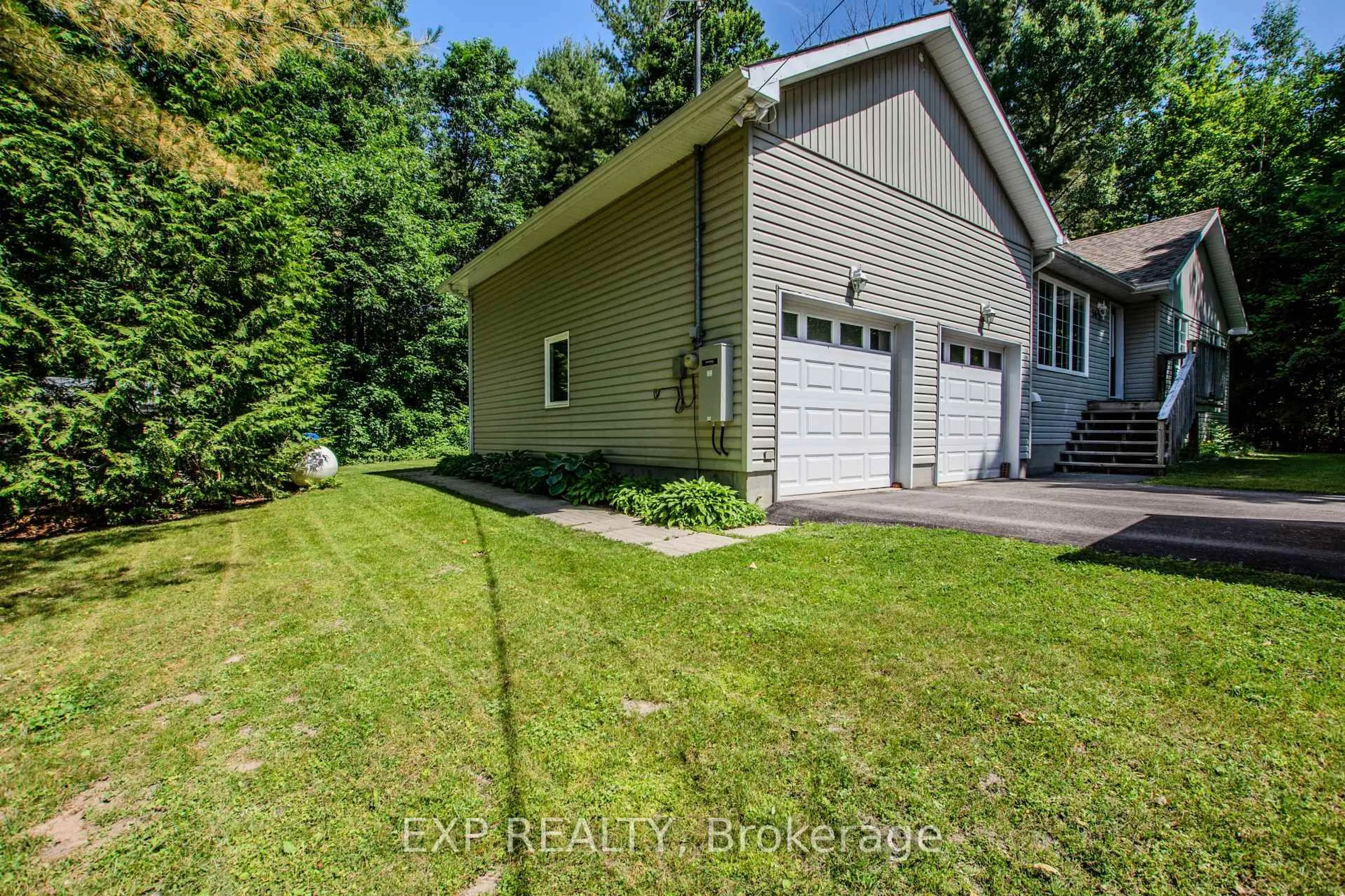 A pic from outside/outdoor area/front of a property/back of a property/a pic from drone, street for 56 Becketts Side Rd, Tay Ontario L0K 2C0