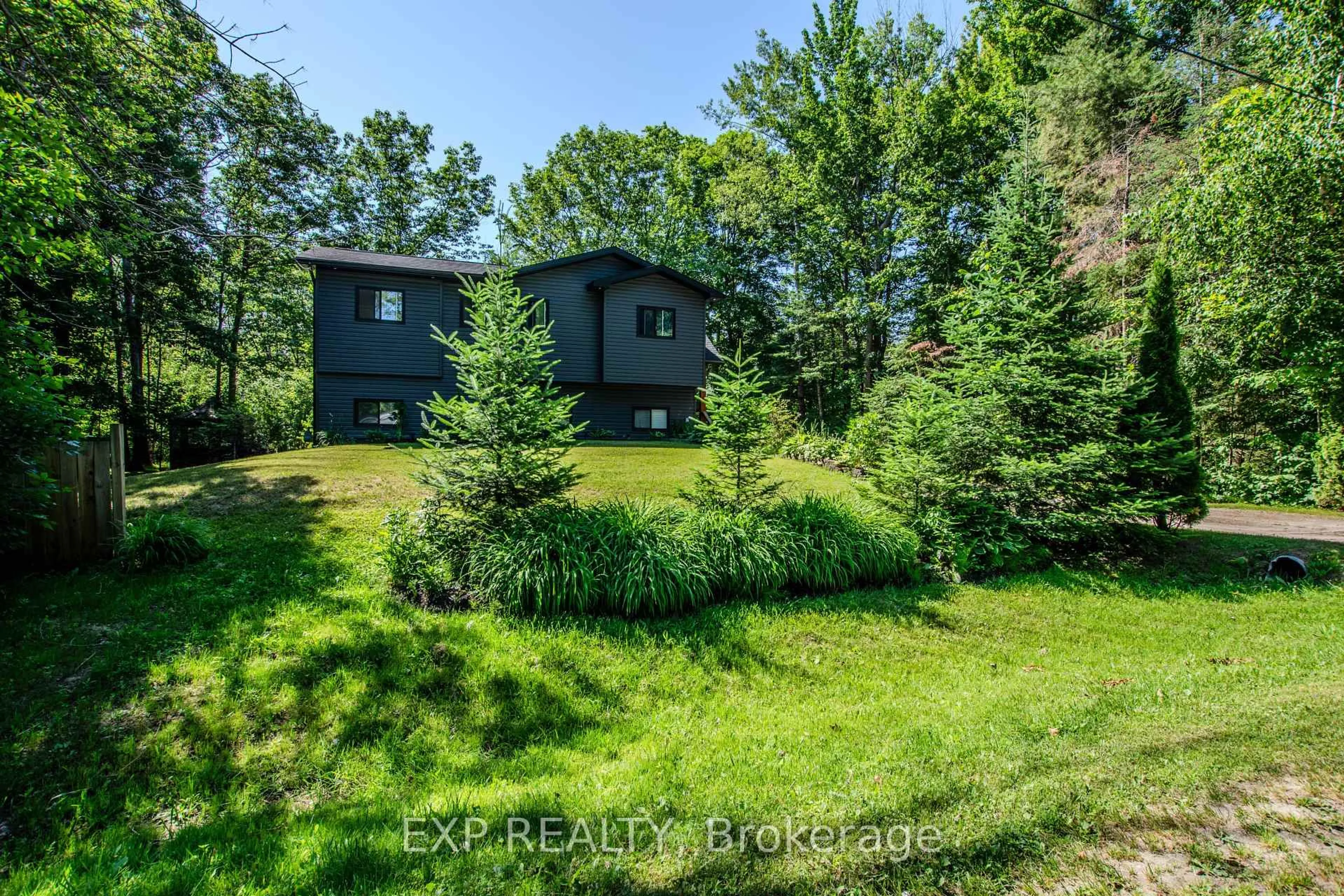 A pic from outside/outdoor area/front of a property/back of a property/a pic from drone, forest/trees view for 39 Becketts Sdrd, Tay Ontario L0K 2C0