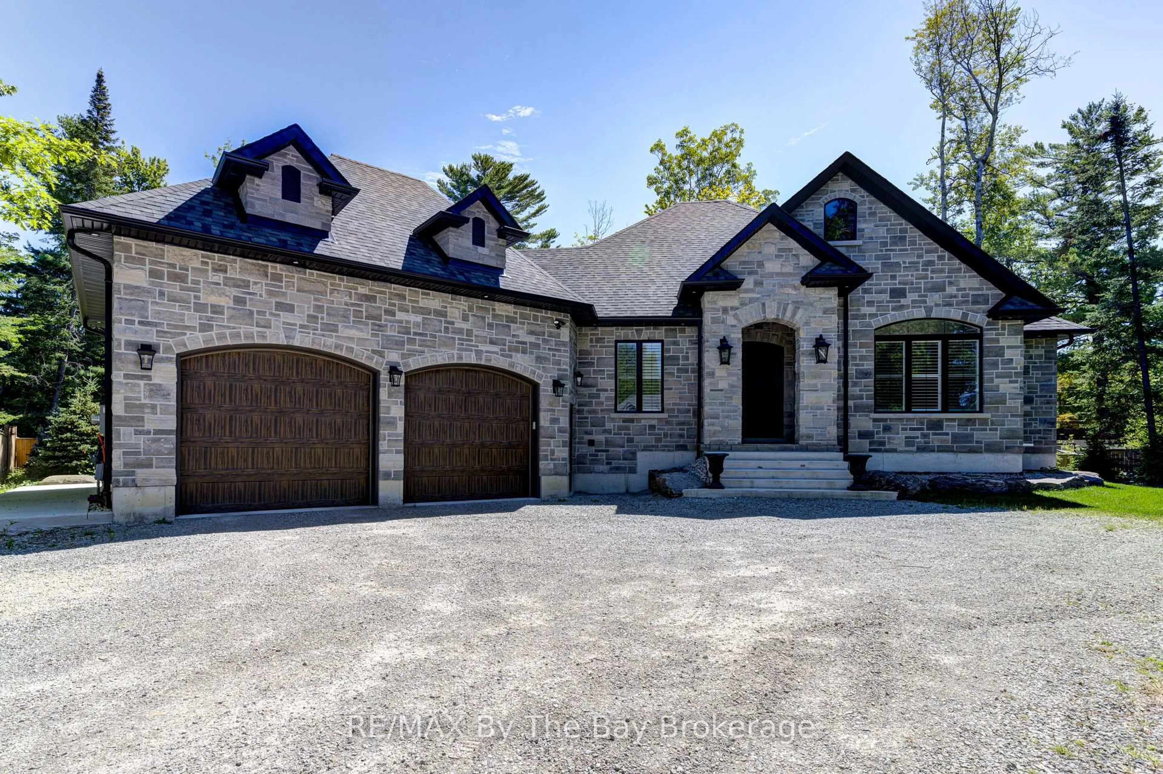 Home with brick exterior material, street for 833 Eastdale Dr, Wasaga Beach Ontario L9Z 2R5