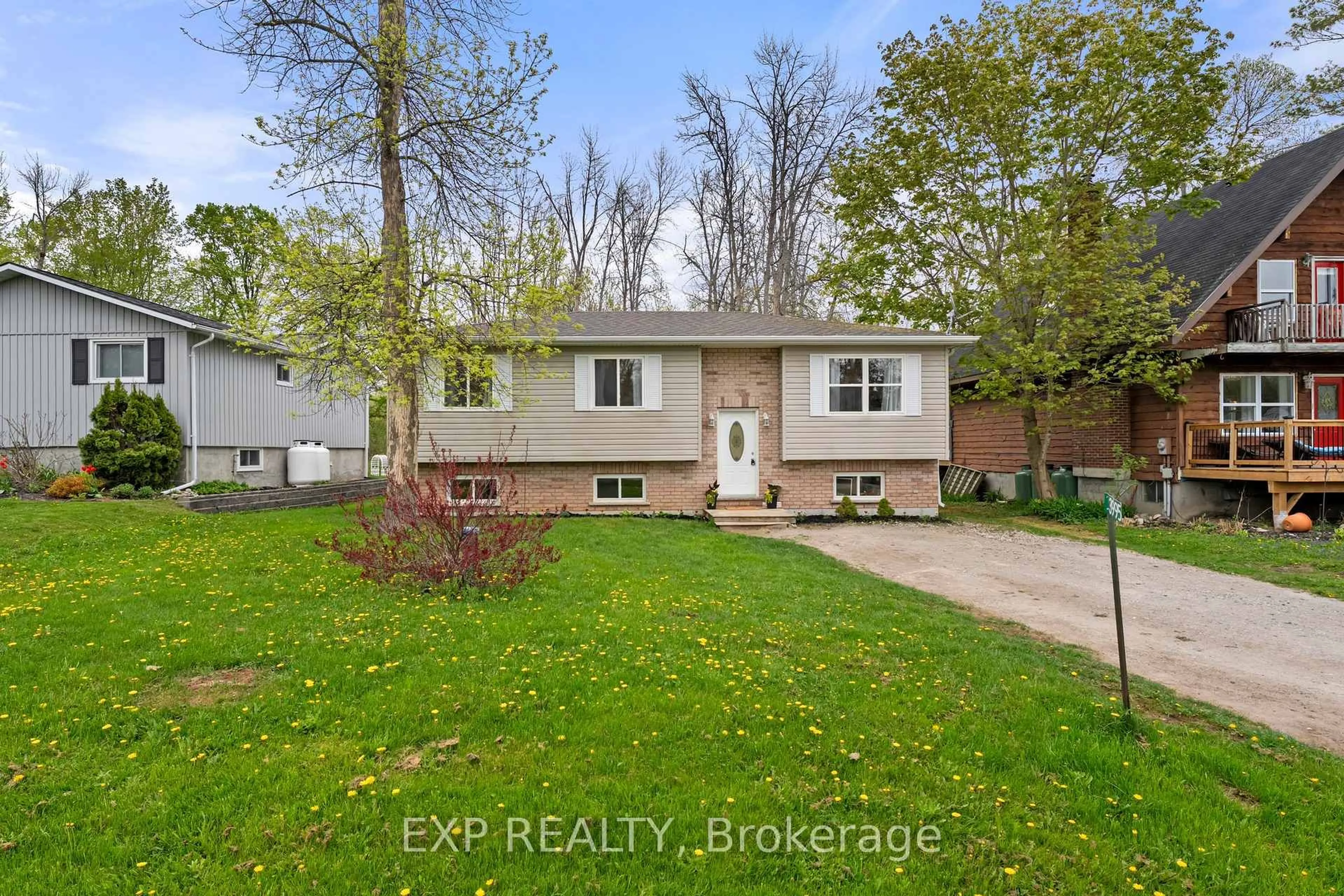 Home with vinyl exterior material, street for 3995 Woodland Dr, Ramara Ontario L3V 0S2