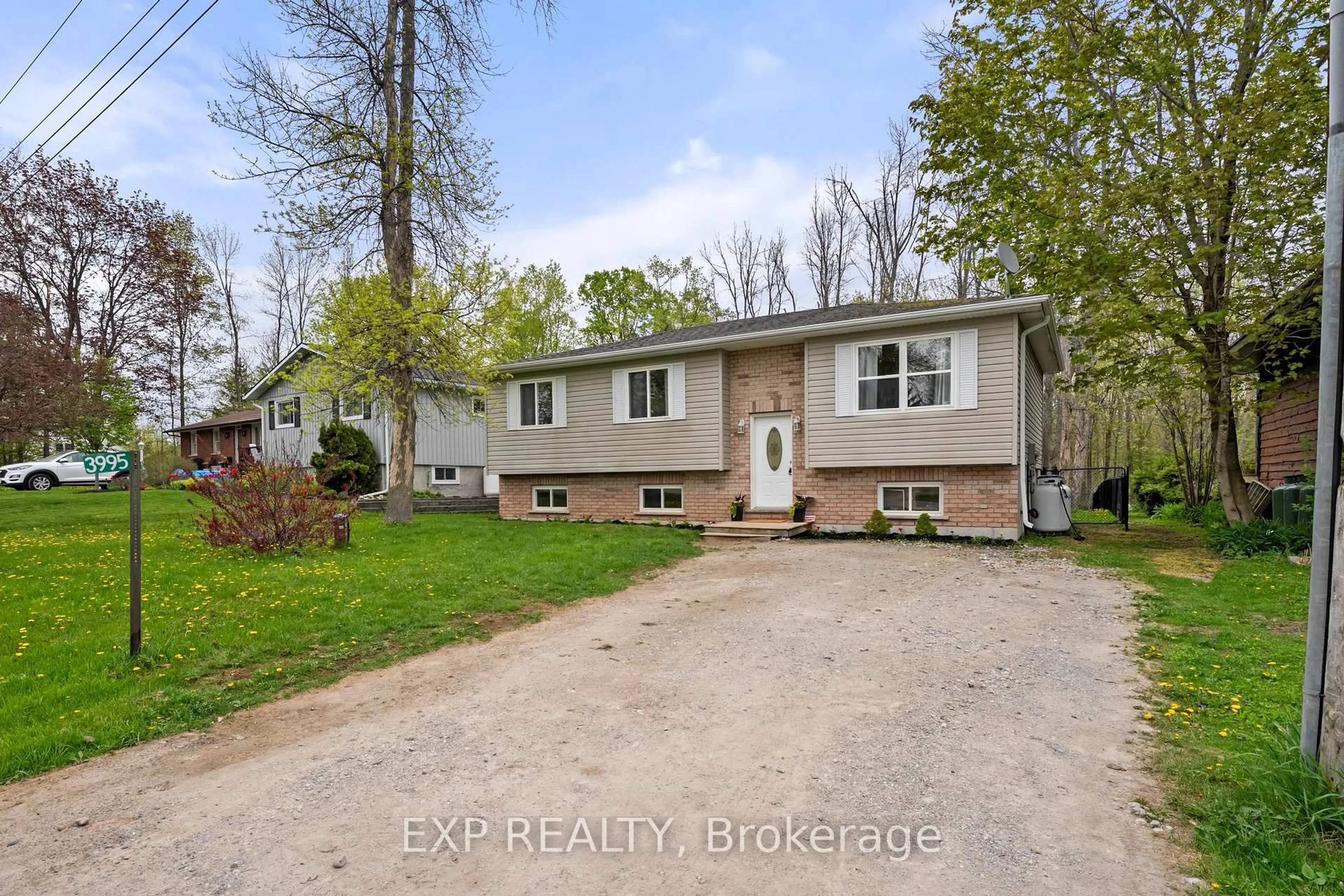 Home with vinyl exterior material, street for 3995 Woodland Dr, Ramara Ontario L3V 0S2