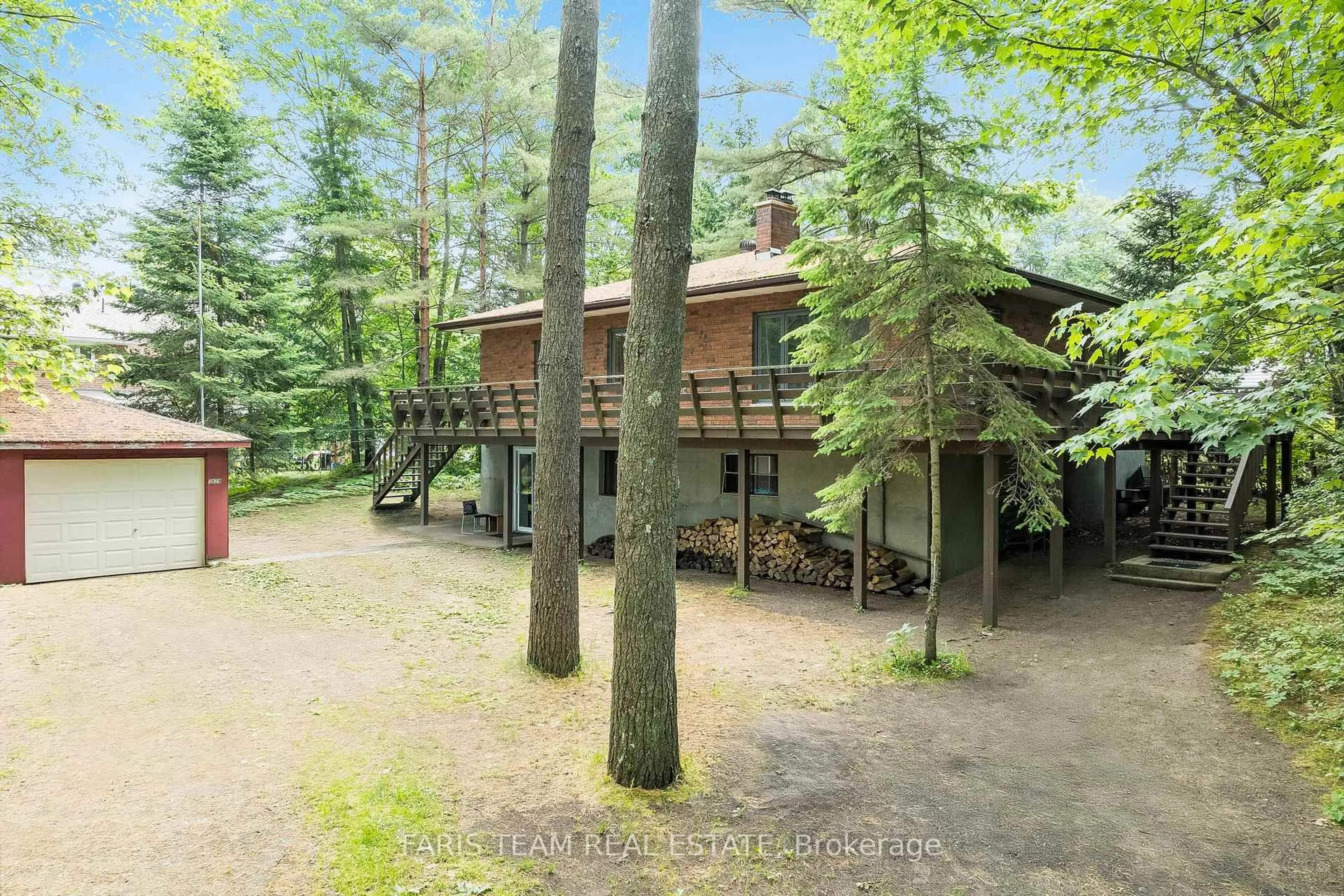 A pic from outside/outdoor area/front of a property/back of a property/a pic from drone, forest/trees view for 519 Tiny Beaches Rd, Tiny Ontario L0L 2J0