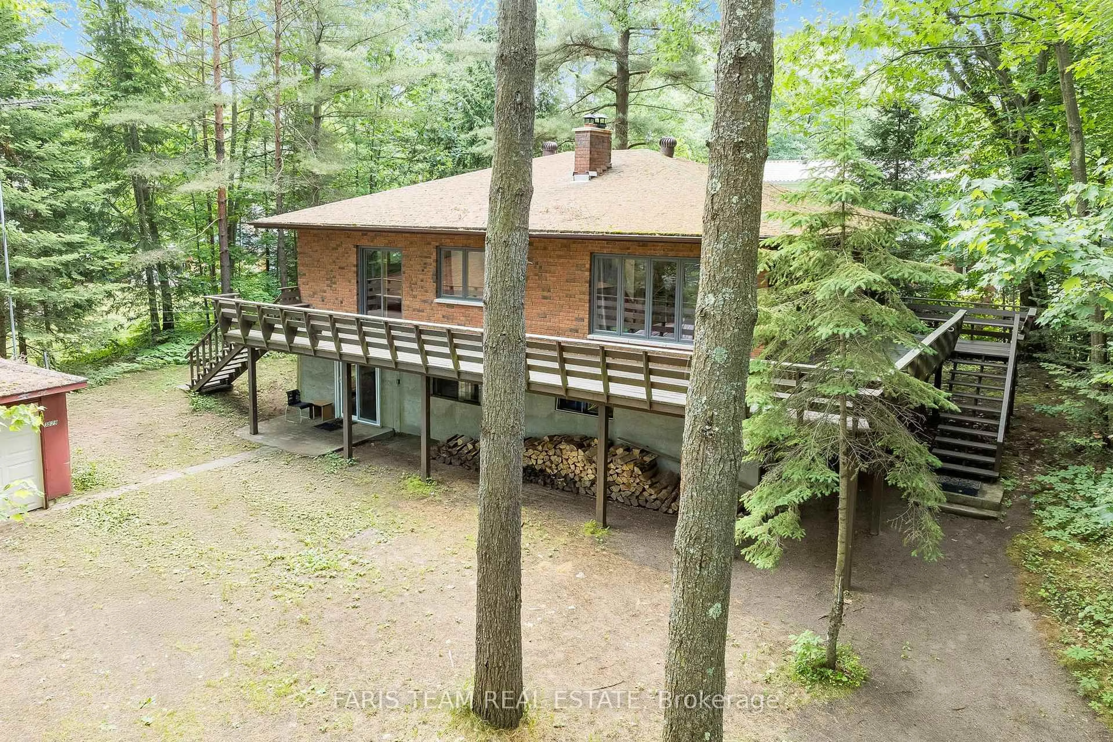 A pic from outside/outdoor area/front of a property/back of a property/a pic from drone, forest/trees view for 519 Tiny Beaches Rd, Tiny Ontario L0L 2J0