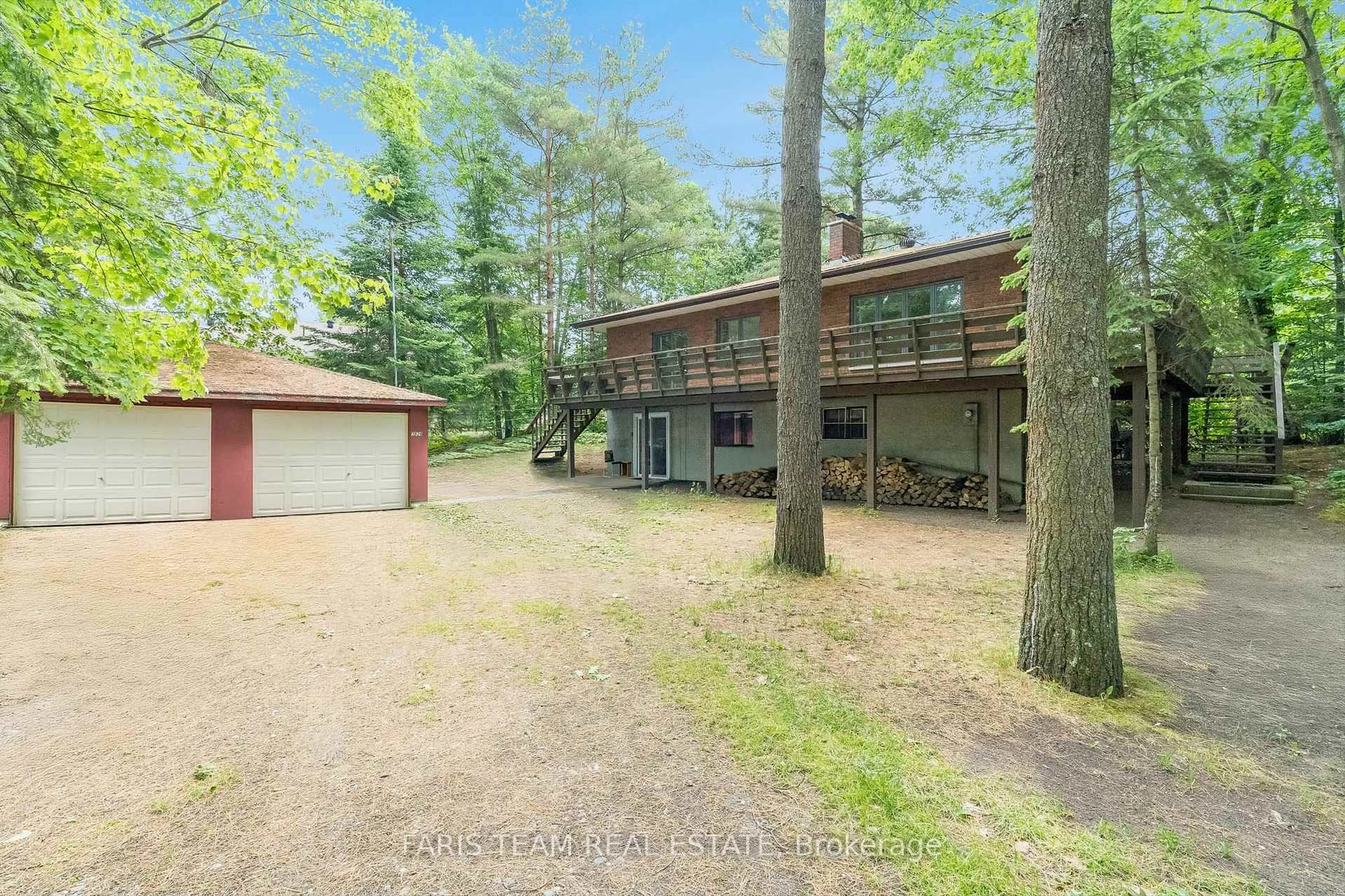 A pic from outside/outdoor area/front of a property/back of a property/a pic from drone, forest/trees view for 519 Tiny Beaches Rd, Tiny Ontario L0L 2J0
