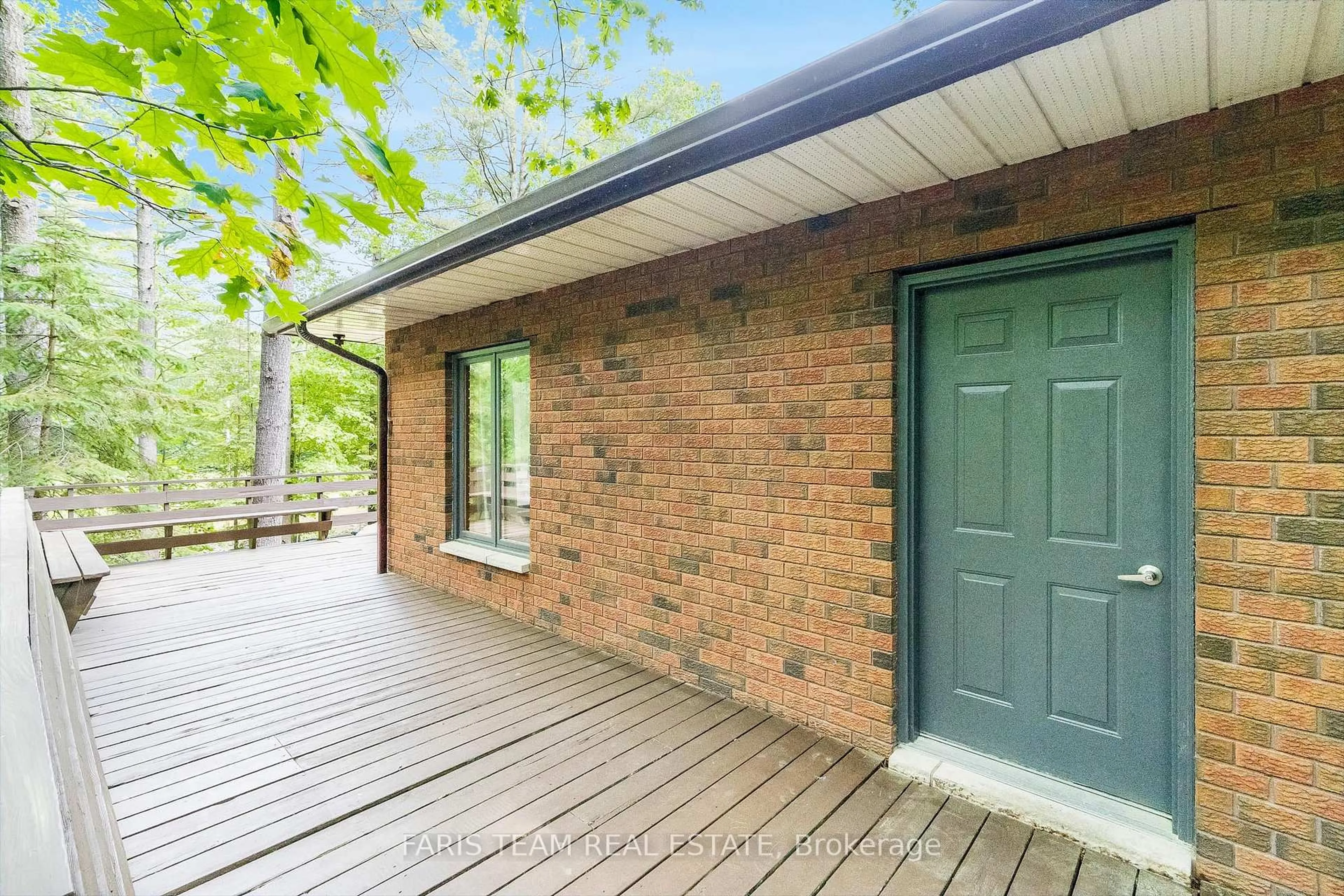 Home with brick exterior material, street for 519 Tiny Beaches Rd, Tiny Ontario L0L 2J0