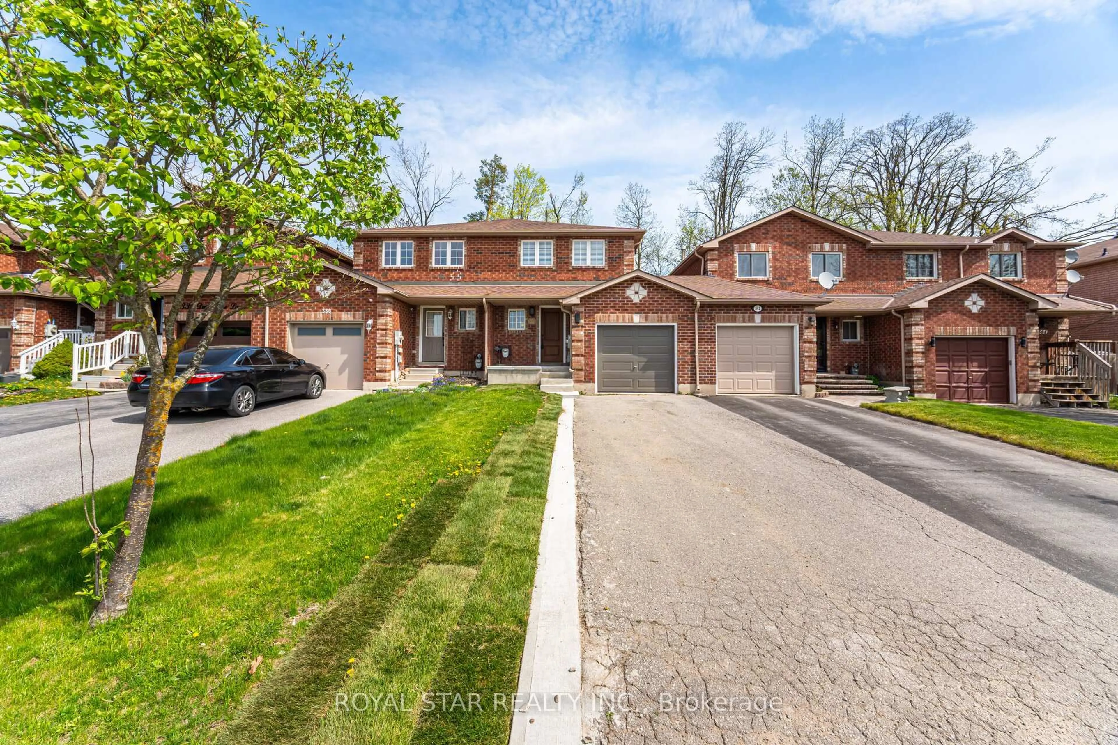 Home with brick exterior material, street for 340 Dunsmore Lane, Barrie Ontario L4M 7B2
