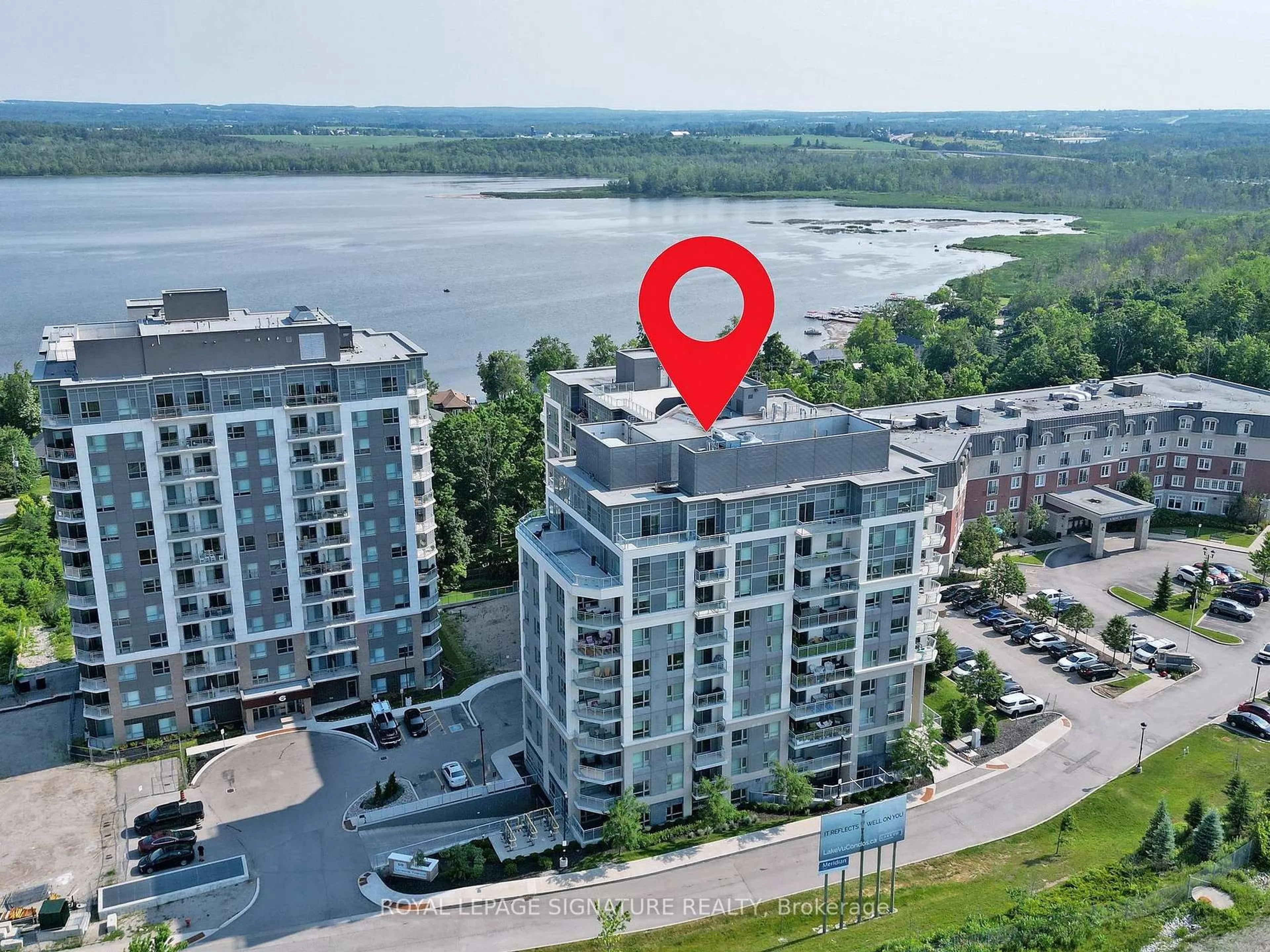 A pic from outside/outdoor area/front of a property/back of a property/a pic from drone, water/lake/river/ocean view for 58 Lakeside Terr #703, Barrie Ontario L0K 1S0