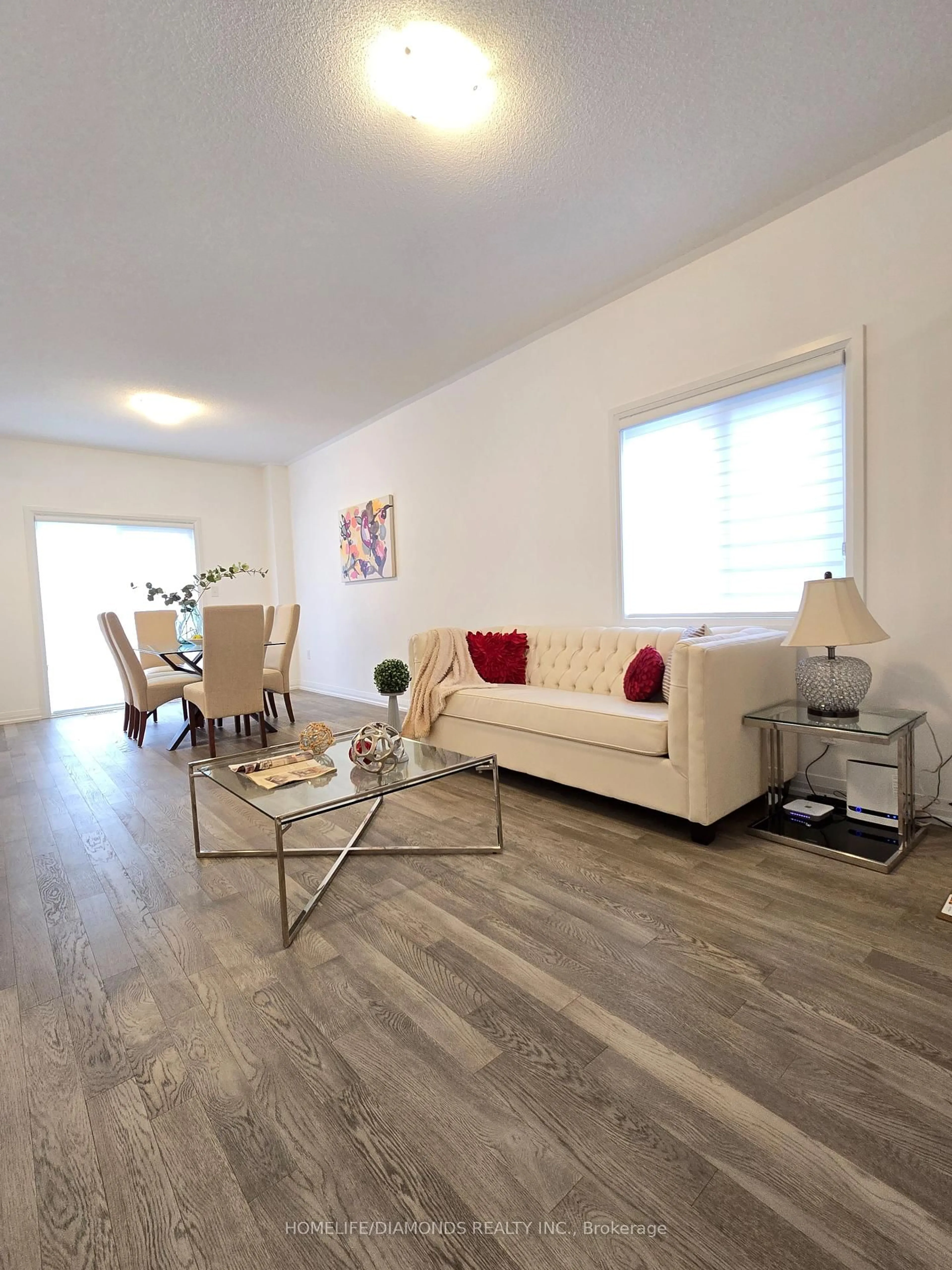 Living room with furniture, wood/laminate floor for 49 KODA St, Barrie Ontario L9J 0H7