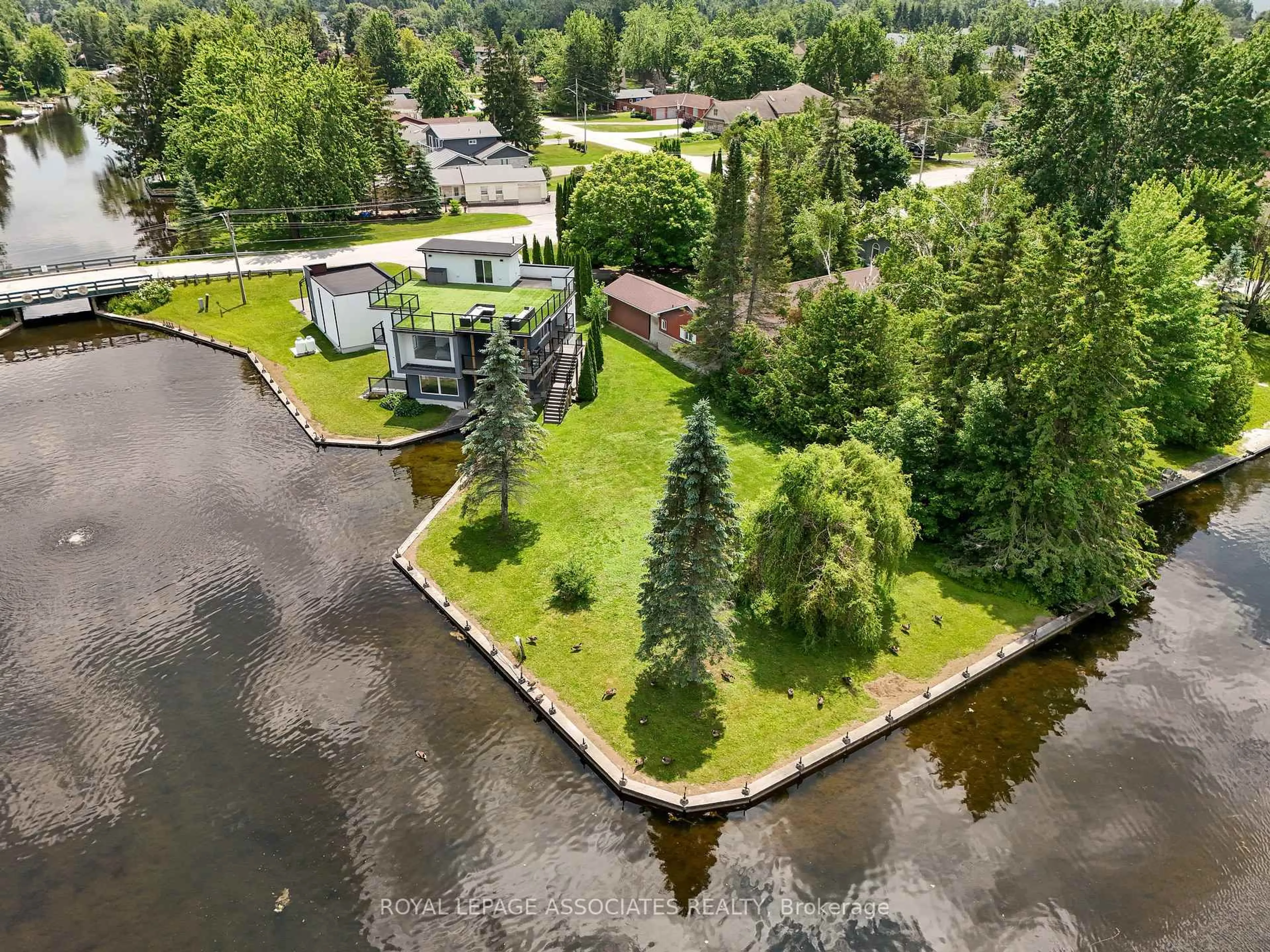 A pic from outside/outdoor area/front of a property/back of a property/a pic from drone, water/lake/river/ocean view for 57 Poplar Cres, Ramara Ontario L0K 1B0