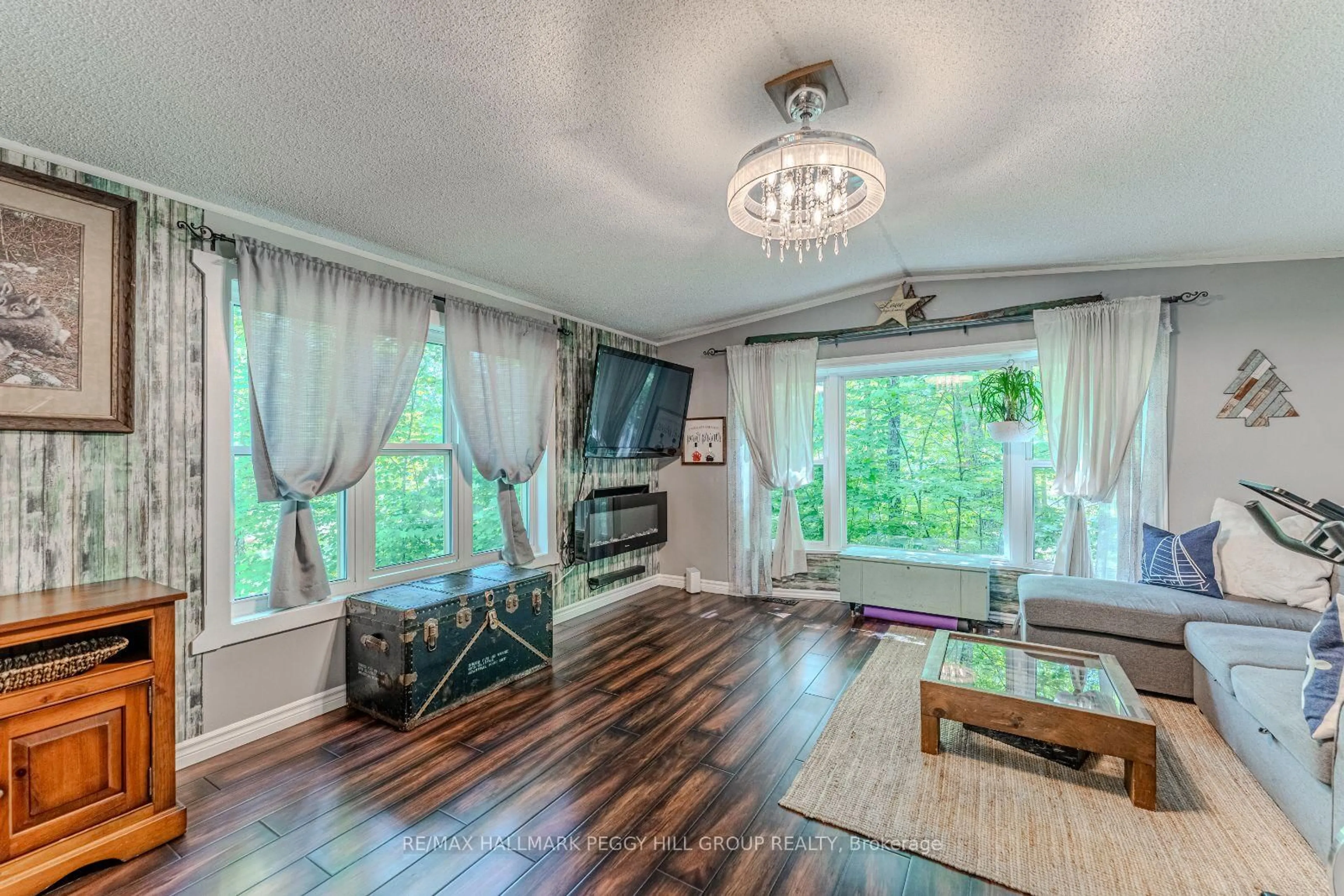 Living room with furniture, wood/laminate floor for 7498 Island Cres, Ramara Ontario L0K 2B0