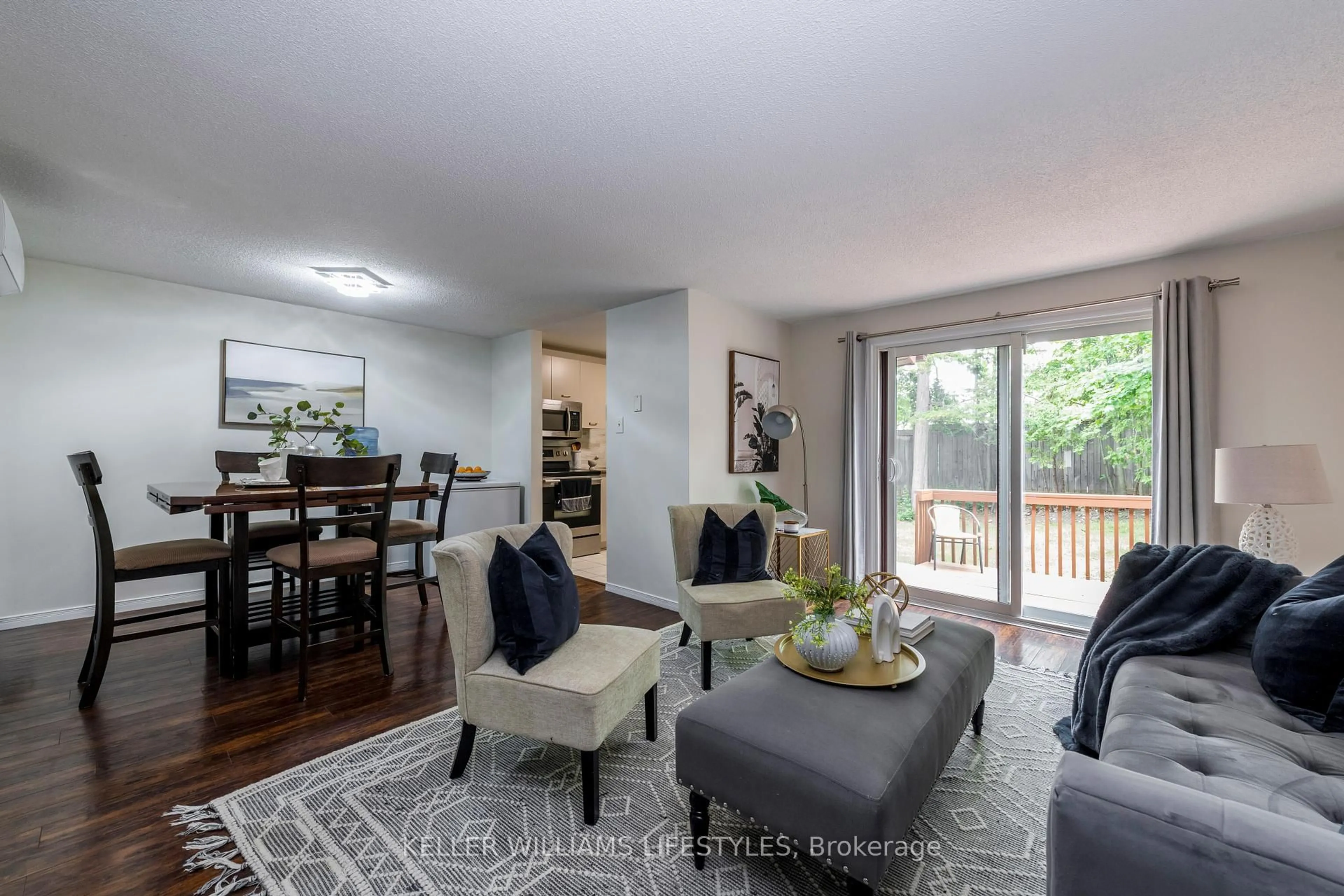 Living room with furniture, wood/laminate floor for 19 Quail Cres, Barrie Ontario L4N 6X1