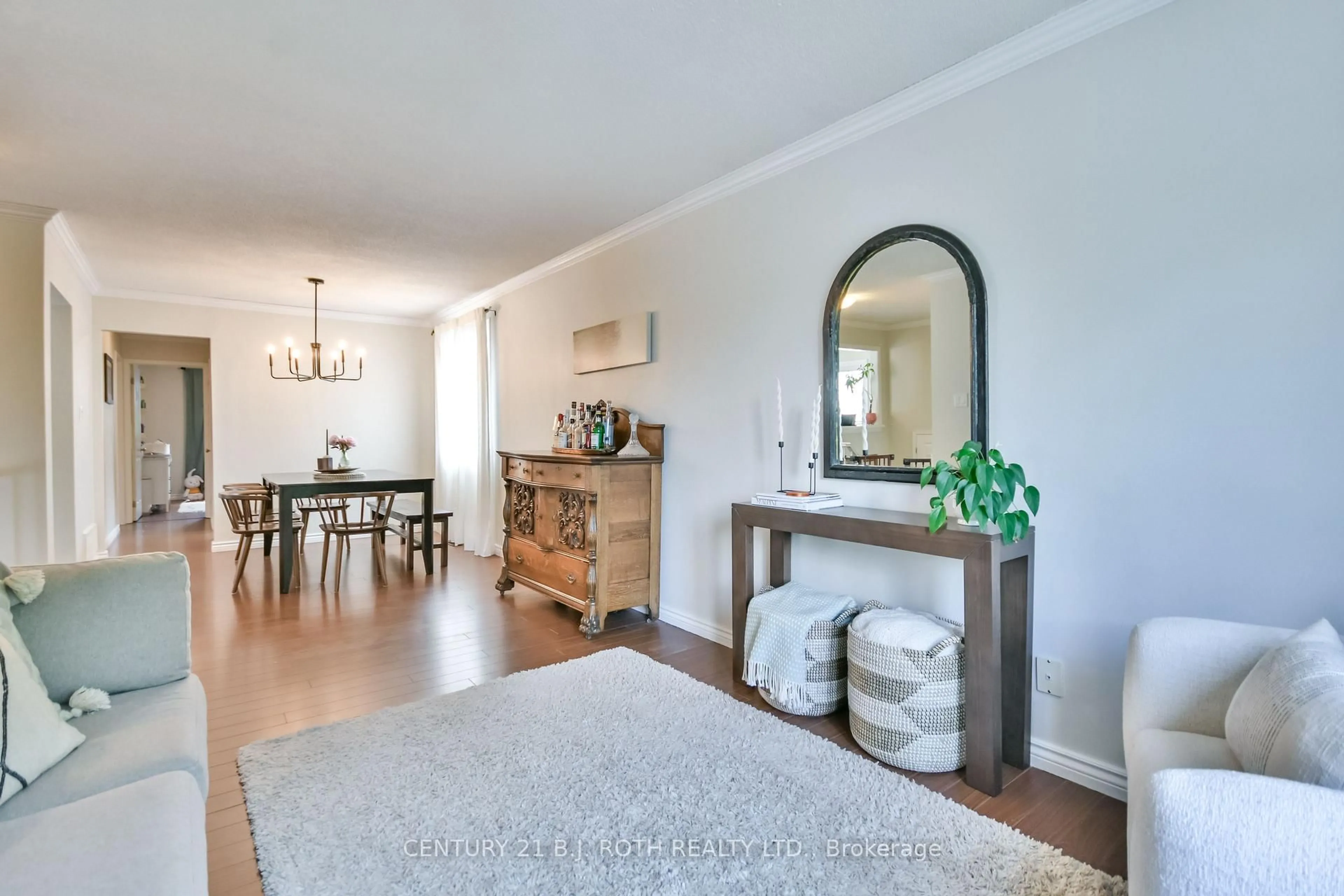 Living room with furniture, wood/laminate floor for 57 D'ambrosio Dr, Barrie Ontario L4N 6V4