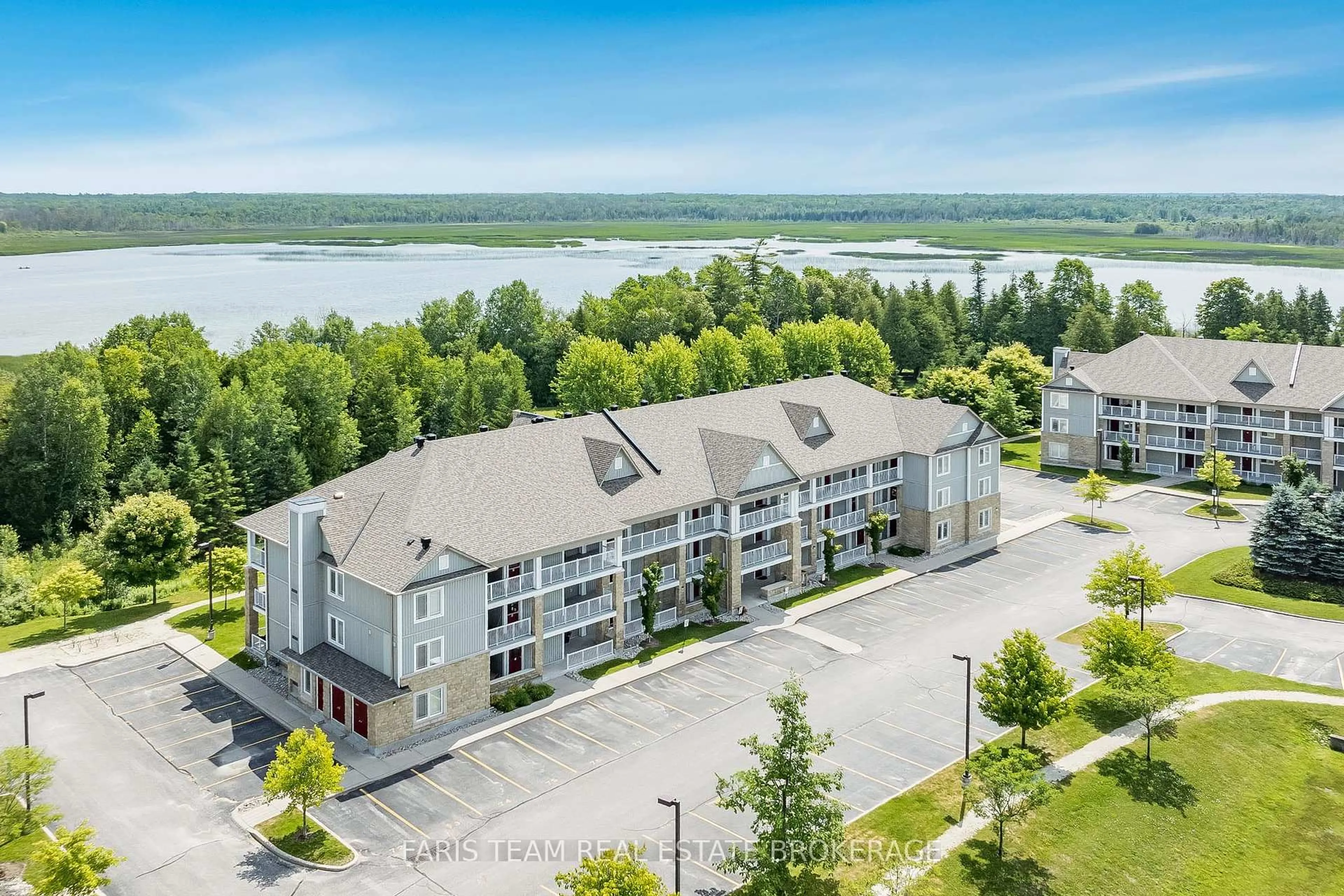 A pic from outside/outdoor area/front of a property/back of a property/a pic from drone, water/lake/river/ocean view for 50 Mulligan Lane #110, Wasaga Beach Ontario L9Z 0C5