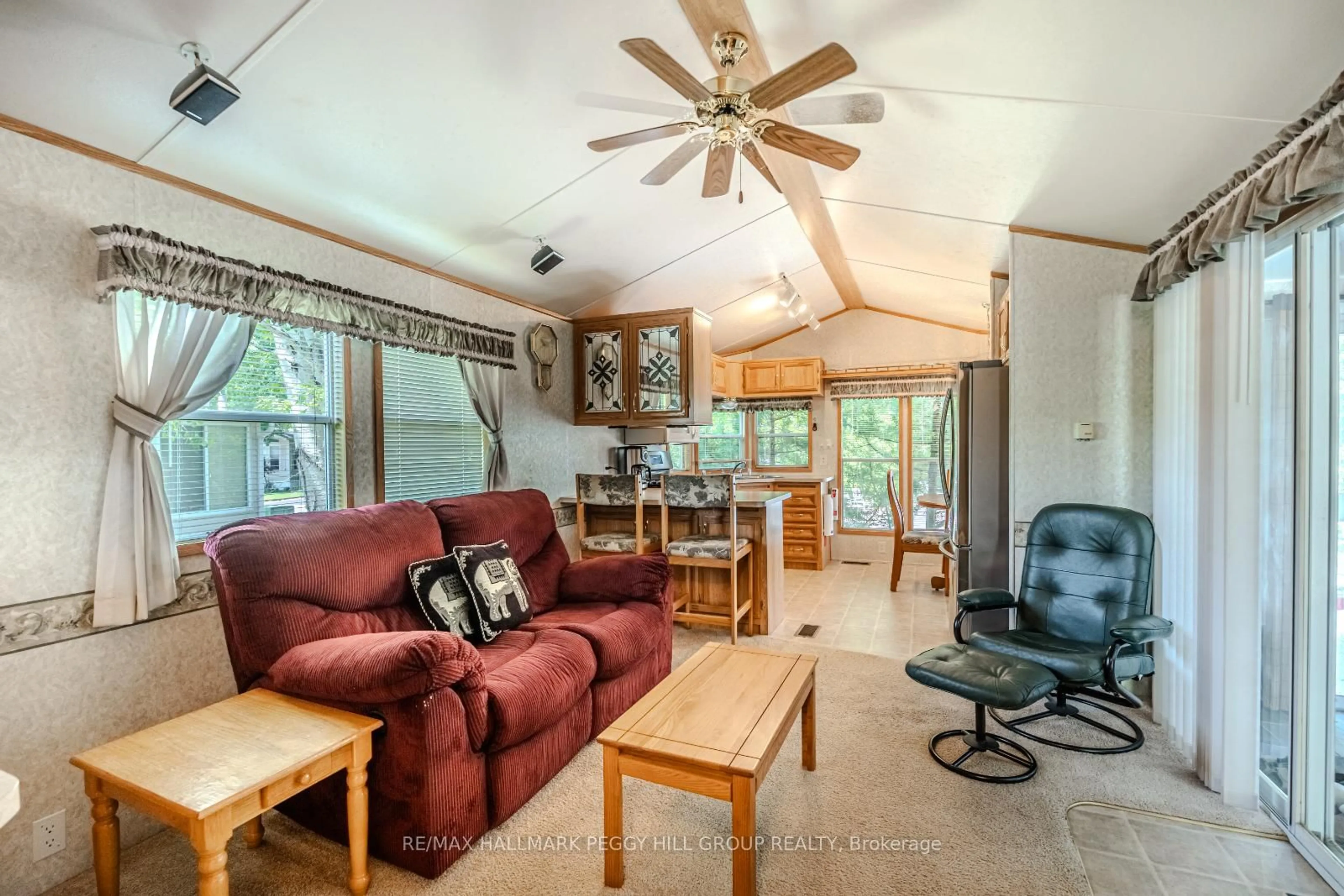 Living room with furniture, wood/laminate floor for 13 Huron Circ, Wasaga Beach Ontario L9Z 1X7
