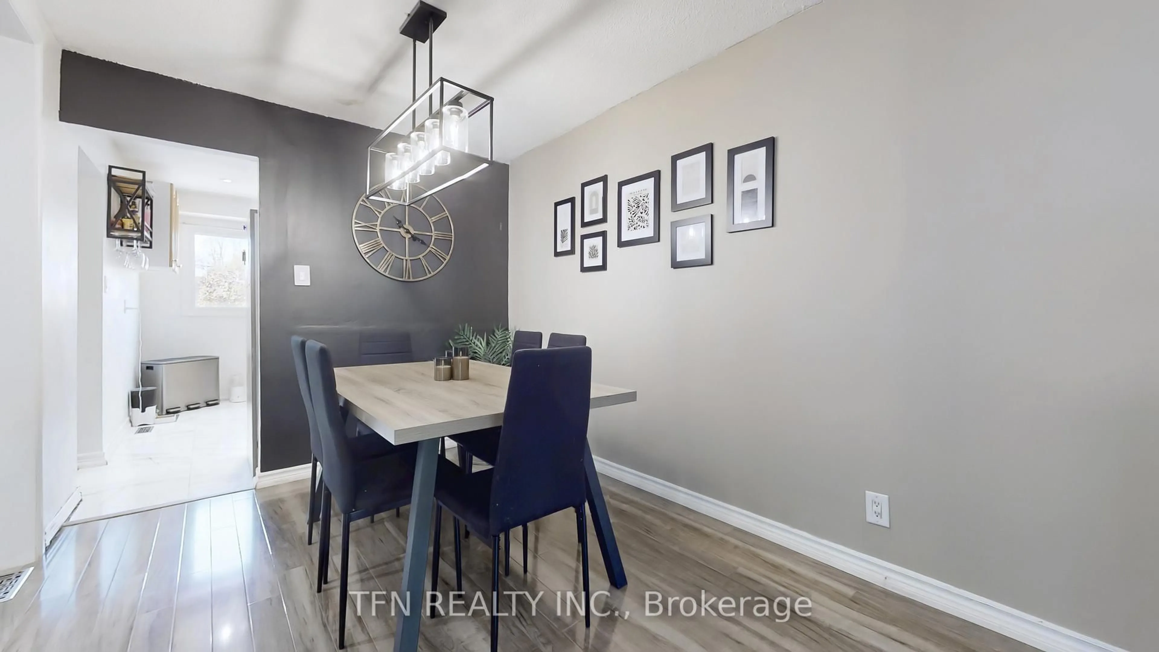 Dining room, wood/laminate floor for 52 Adelaide St #32, Barrie Ontario L4N 3T5