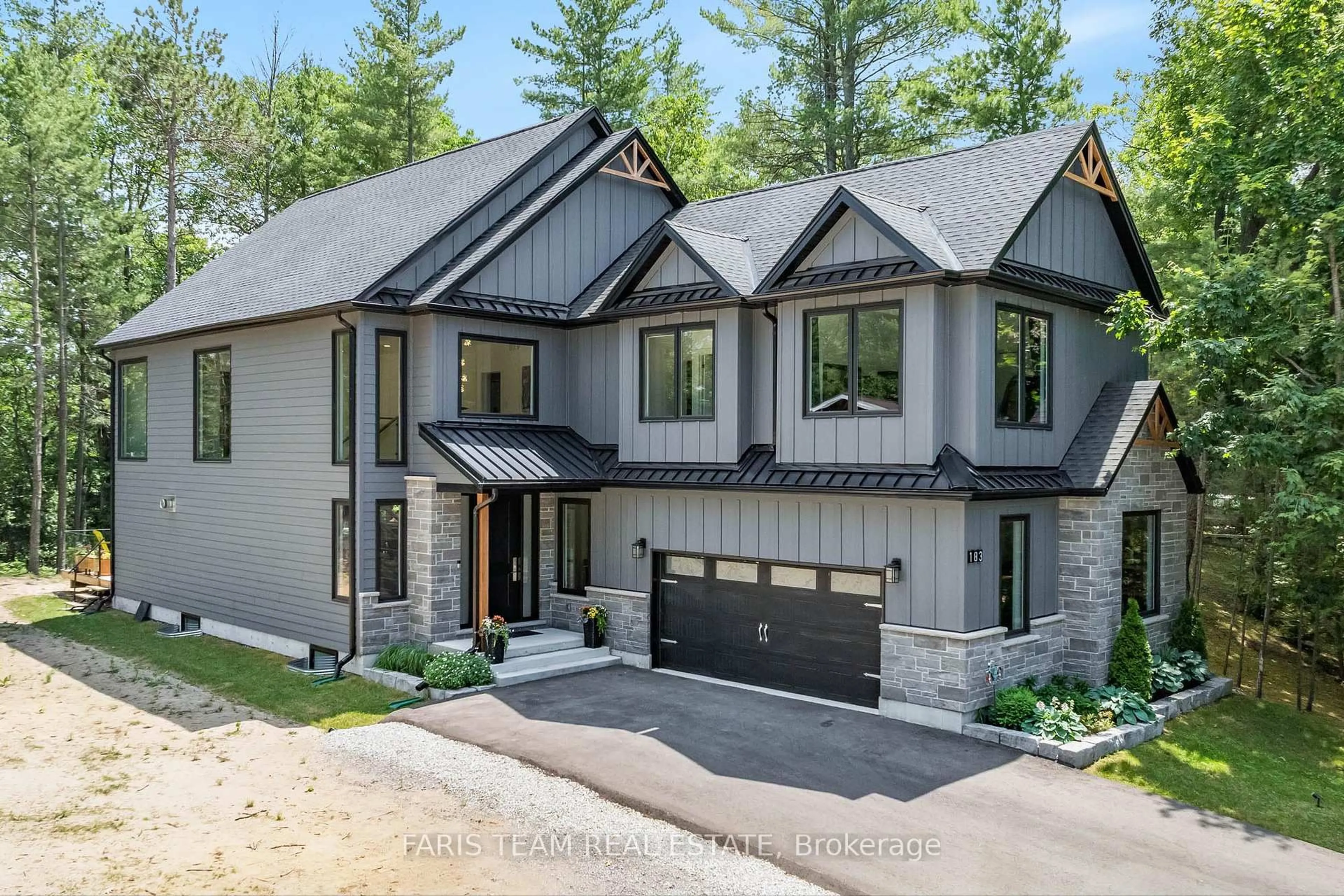 Home with brick exterior material, street for 183 Woodland Dr, Wasaga Beach Ontario L9Z 2V4