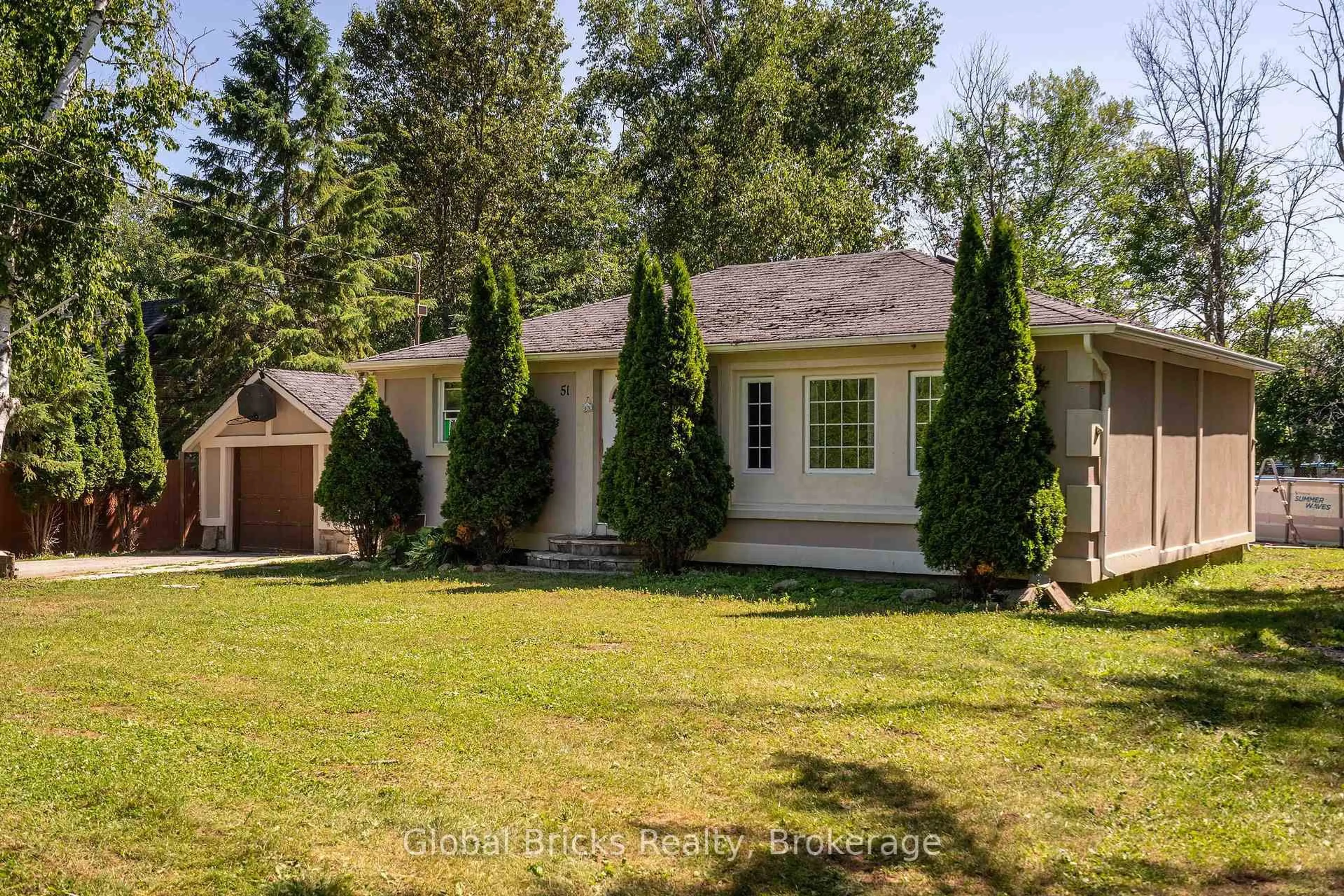 A pic from outside/outdoor area/front of a property/back of a property/a pic from drone, street for 51 75th St, Wasaga Beach Ontario L9Z 2G6