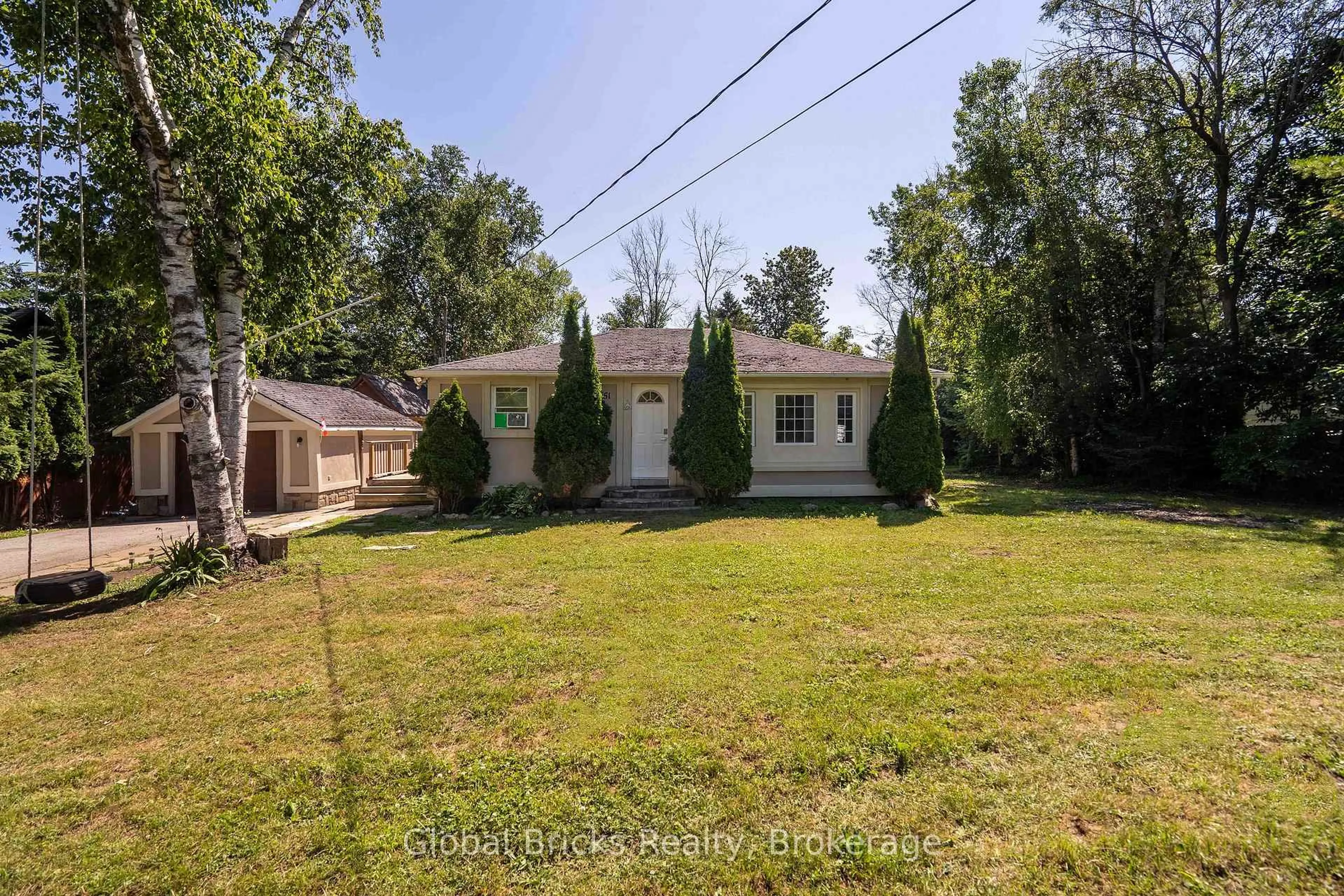A pic from outside/outdoor area/front of a property/back of a property/a pic from drone, street for 51 75th St, Wasaga Beach Ontario L9Z 2G6