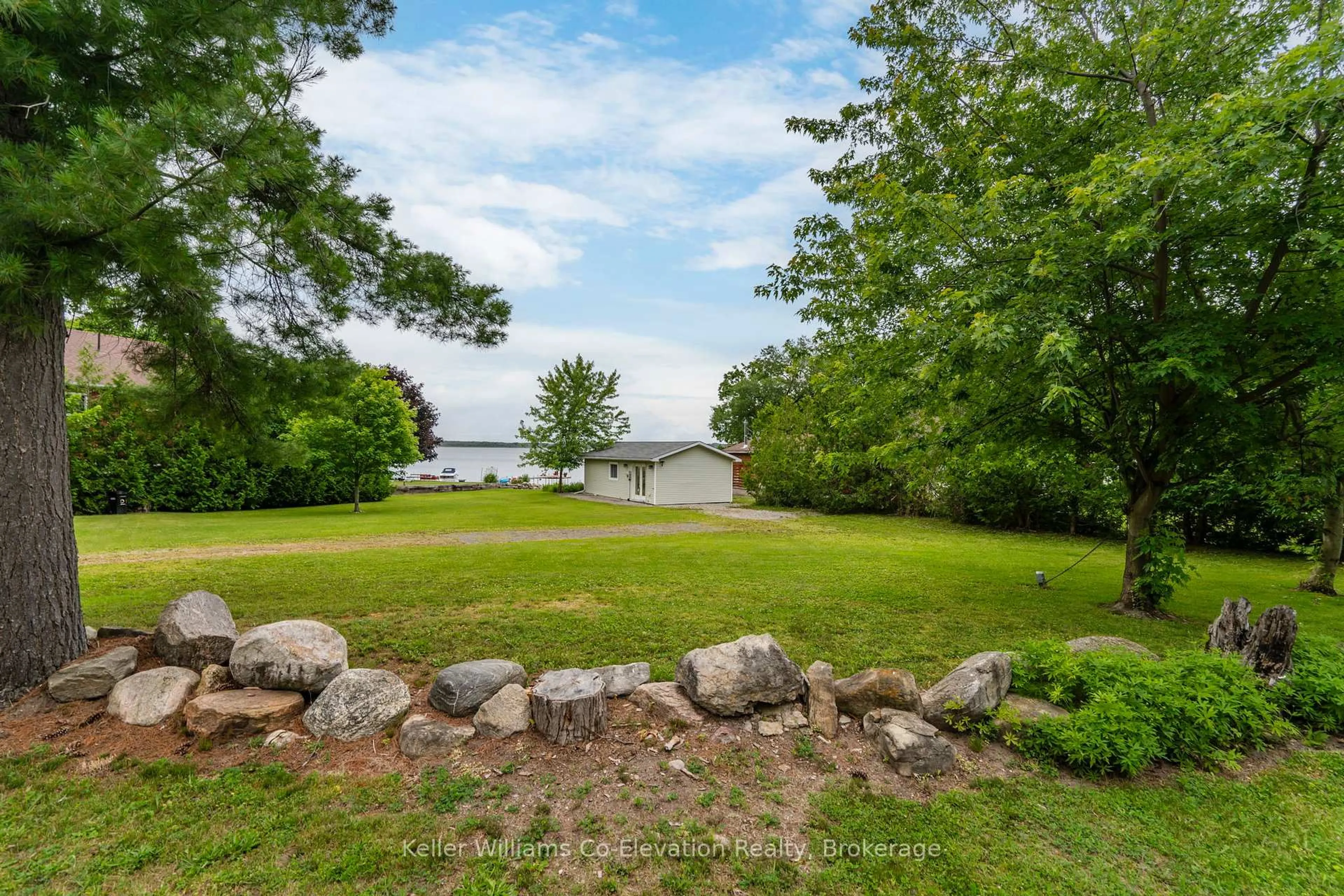 A pic from outside/outdoor area/front of a property/back of a property/a pic from drone, water/lake/river/ocean view for 220 Robin's Point Rd, Tay Ontario L0K 2A0