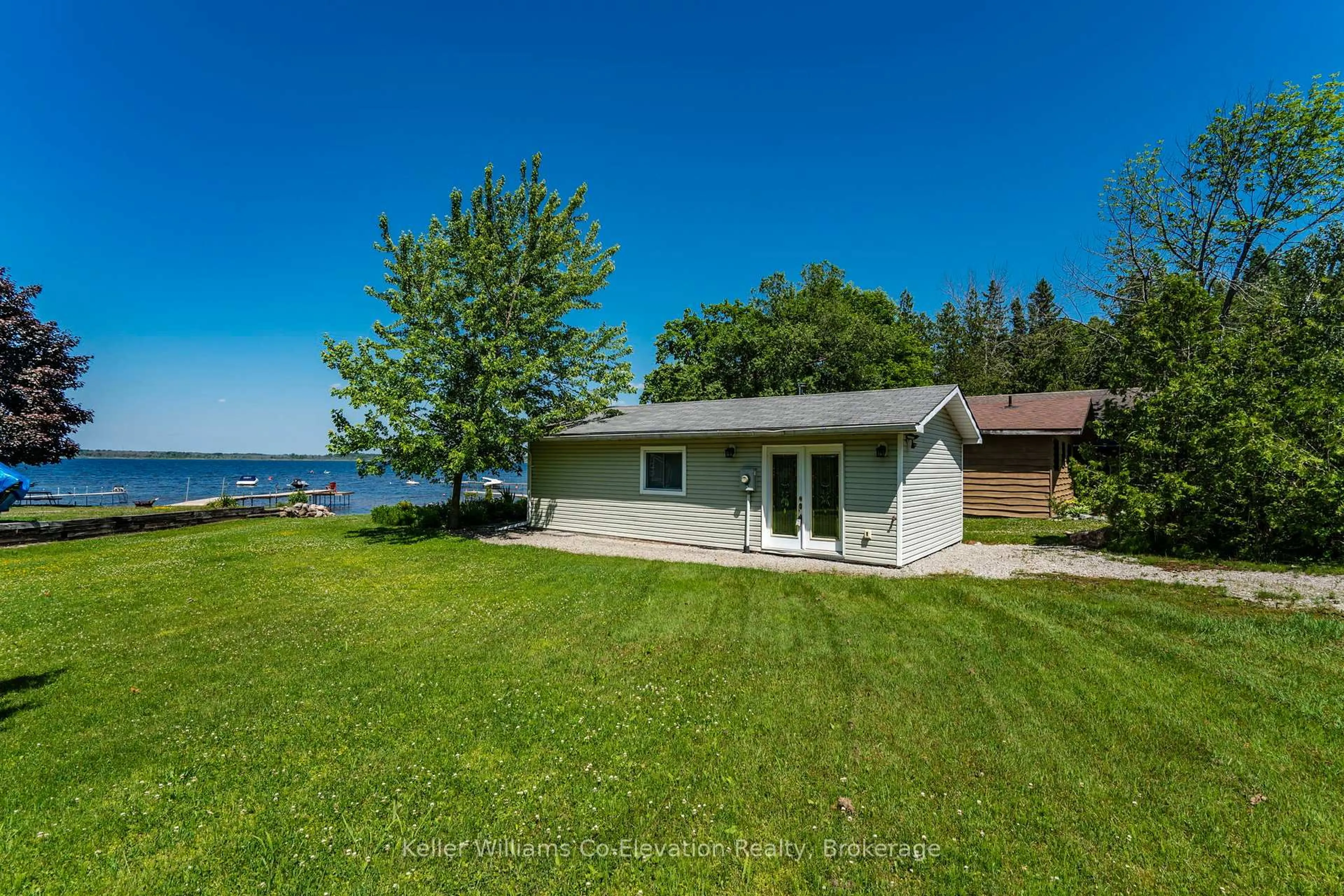 A pic from outside/outdoor area/front of a property/back of a property/a pic from drone, water/lake/river/ocean view for 220 Robin's Point Rd, Tay Ontario L0K 2A0